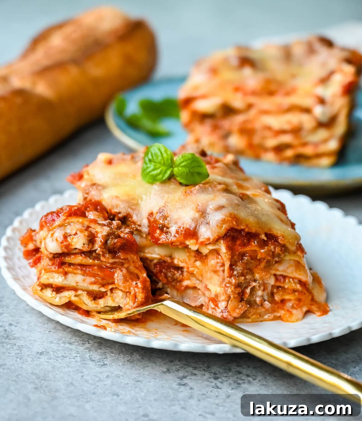 A close-up of baked classic lasagna, with bubbly melted mozzarella and golden-brown edges, ready to be served.