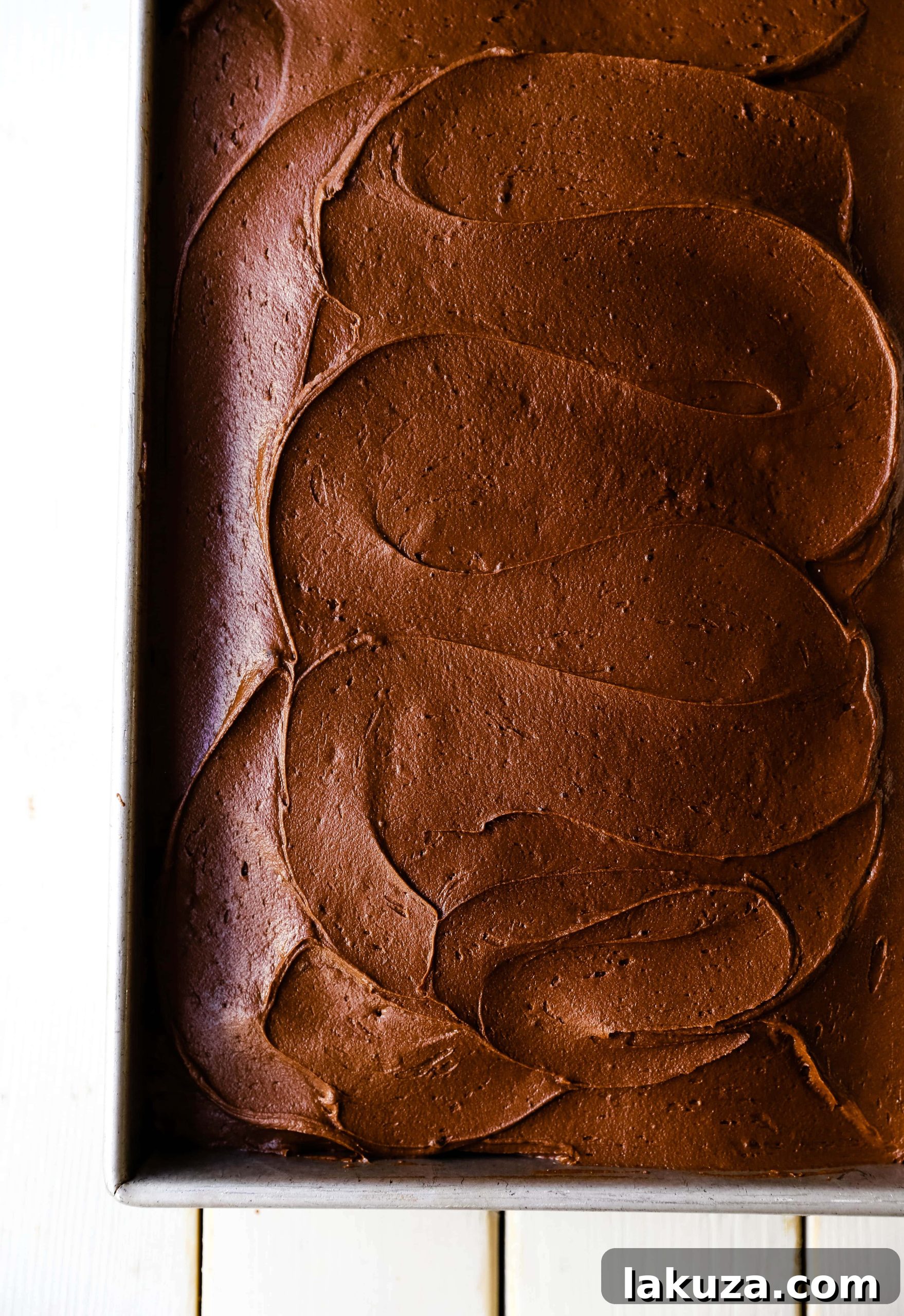 Moist chocolate zucchini cake with rich chocolate buttercream frosting, a perfect way to eat your vegetables without realizing it. The Best Chocolate Zucchini Cake Recipe.