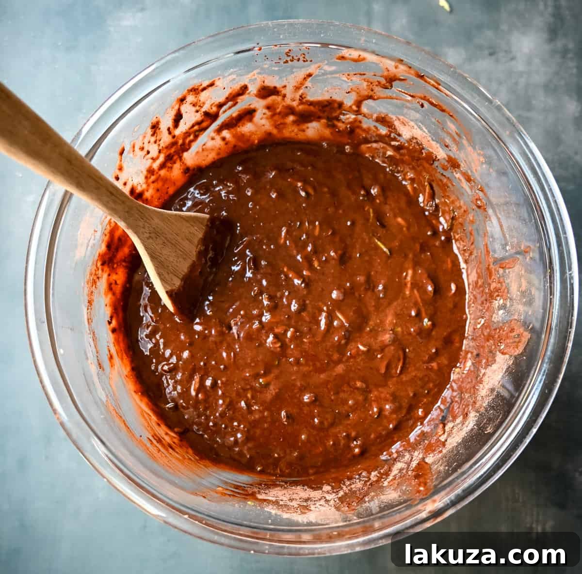 Chocolate zucchini cake batter in a bowl.