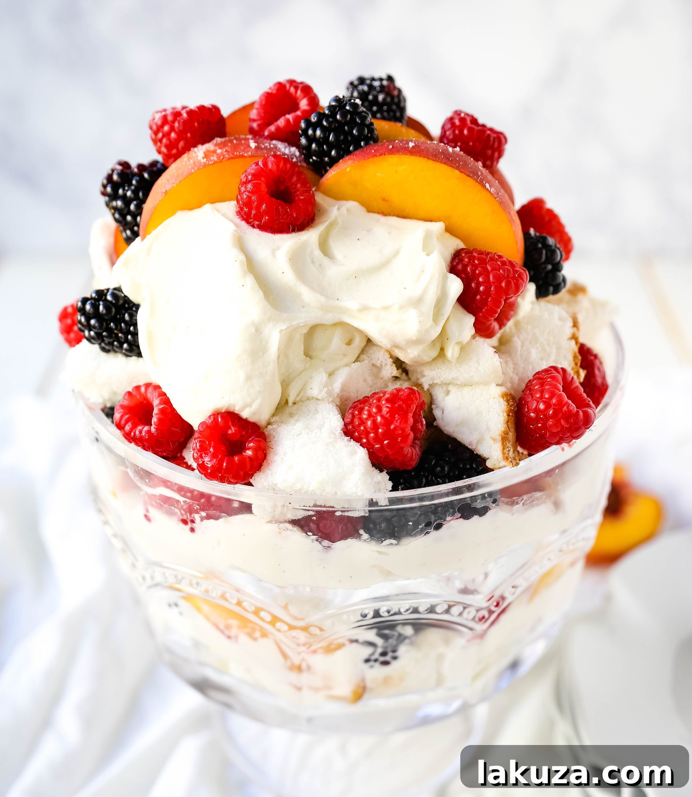 Sweet Peach and Berry Ambrosia 3 Close-up of a layered Peach Berry Trifle with fresh fruit