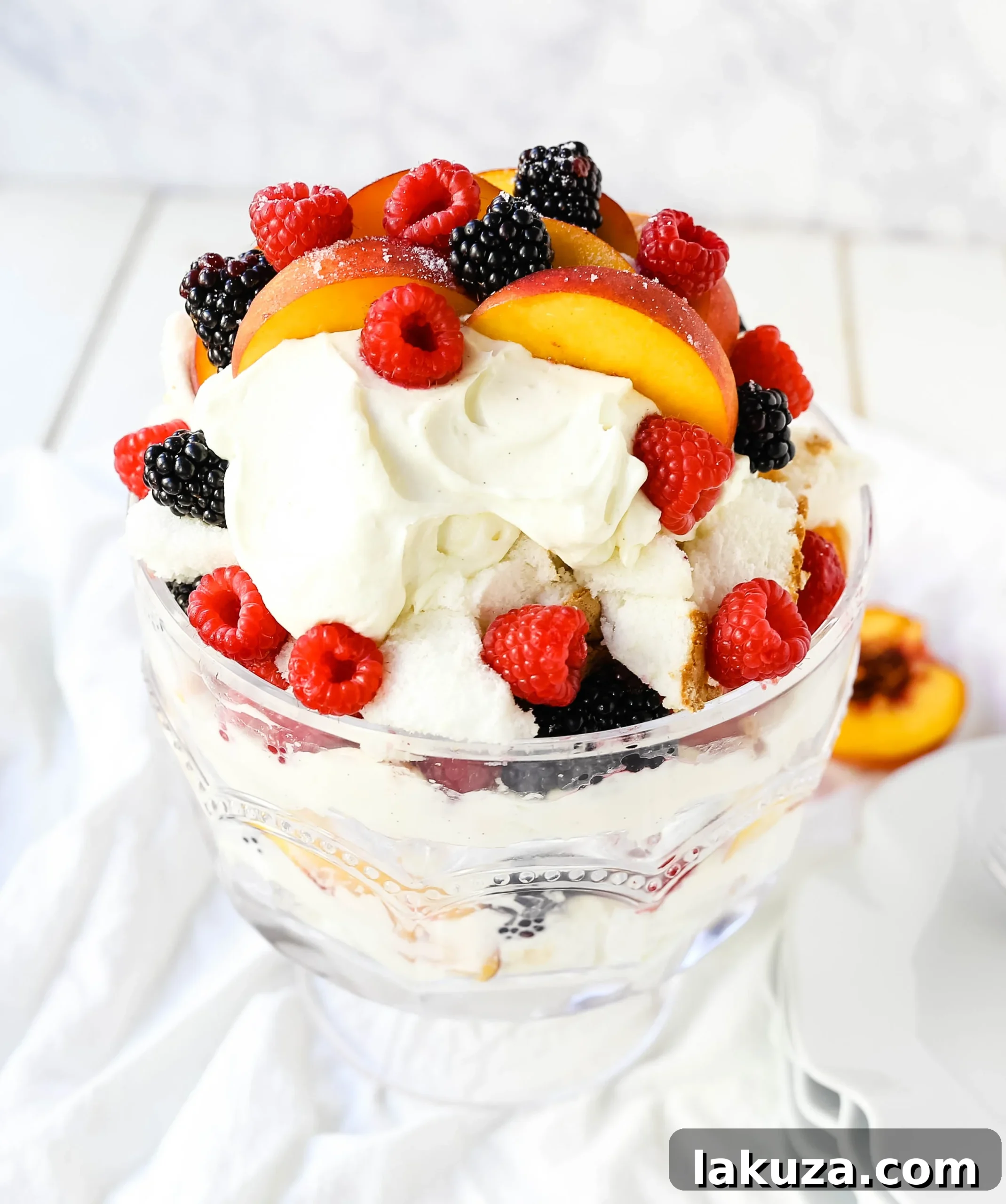 Sweet Peach and Berry Ambrosia 5 Layered Peach Berry Trifle in a glass bowl