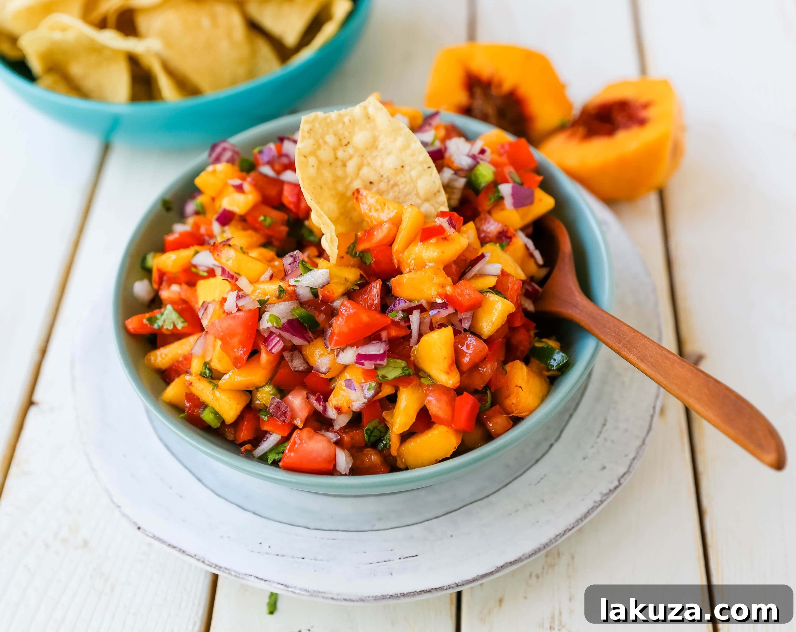 A bowl of Peach Salsa ready to be served, showcasing its chunky texture and fresh ingredients.