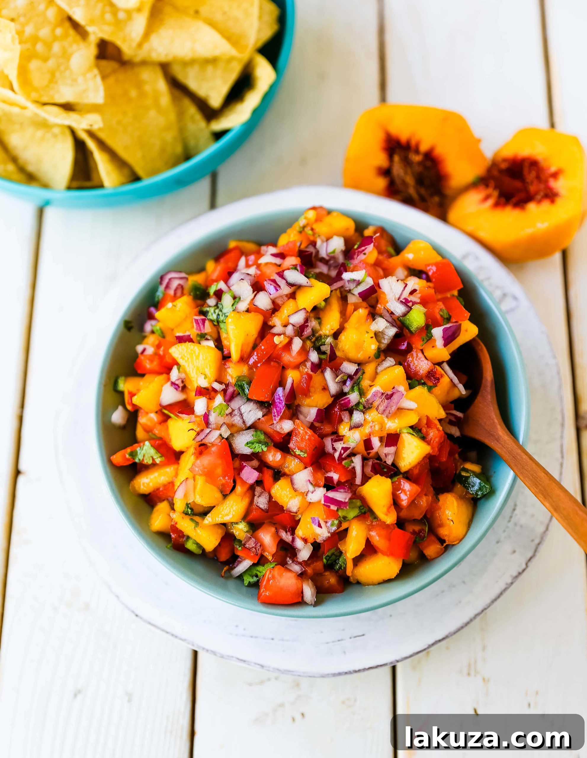 Peach Salsa served in a clear bowl, showing the individual diced ingredients clearly.