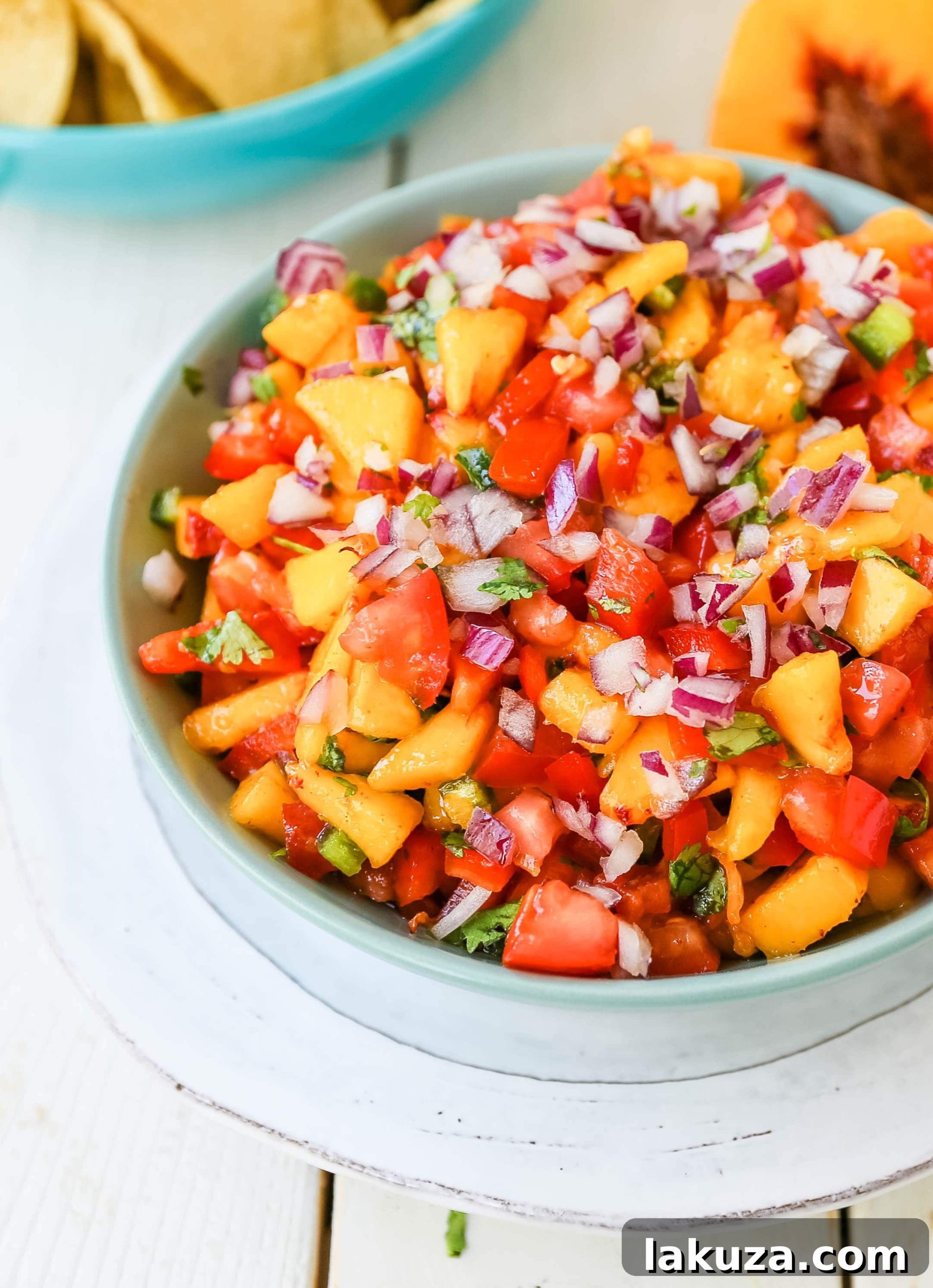 A serving of Peach Salsa with tortilla chips, ready for a party or snack.