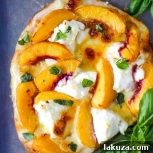 Peach Basil Mozzarella Flatbread with fresh peaches, basil ribbons, ricotta cheese, a drizzle of honey, fresh mozzarella all on a buttery flatbread. The perfect summer pizza!