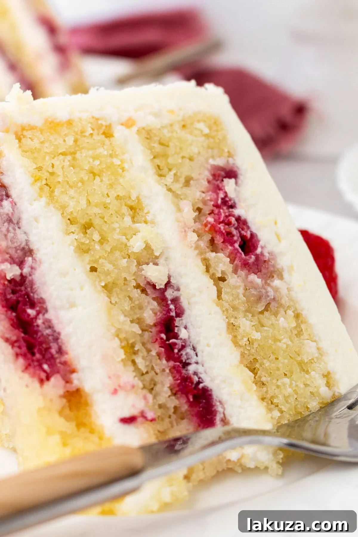 Lemon Raspberry Cake with Lemon Cream Cheese Frosting. A light and fluffy lemon cake with fresh raspberries and a fresh lemon cream cheese frosting. A sweet and tangy lemon berry cake!