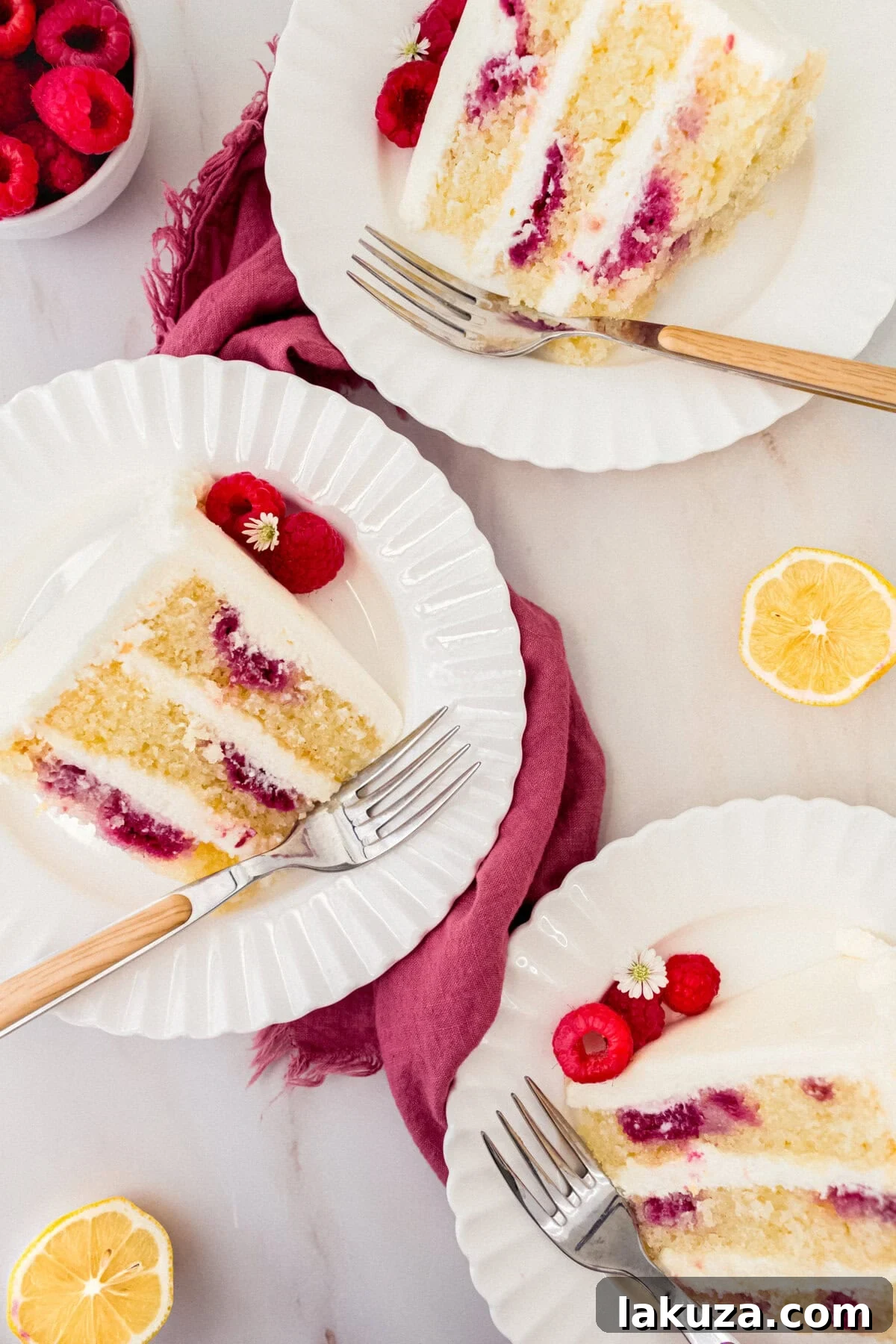 Lemon Raspberry Cake with Lemon Cream Cheese Frosting. A light and fluffy lemon cake with fresh raspberries and a fresh lemon cream cheese frosting. A sweet and tangy lemon berry cake!
