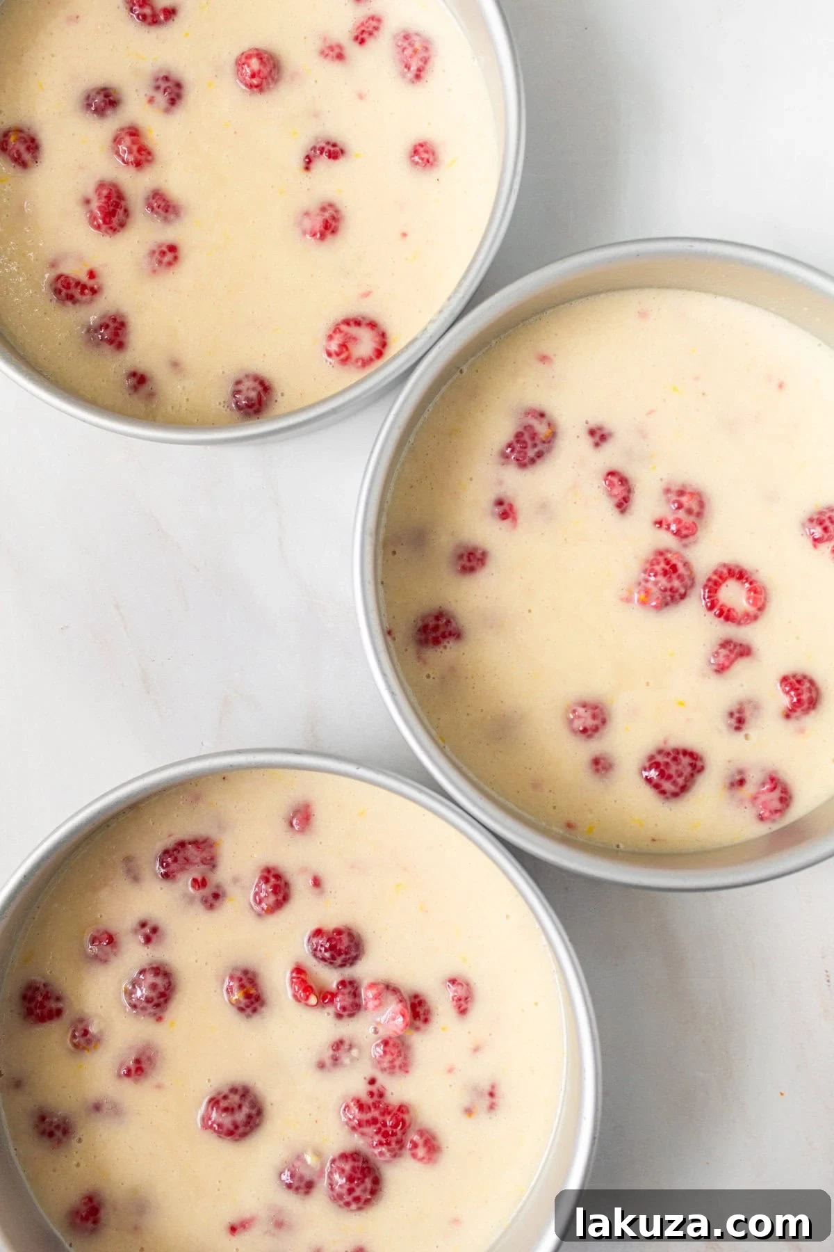 Lemon Raspberry Cake in three 8-inch cake pans