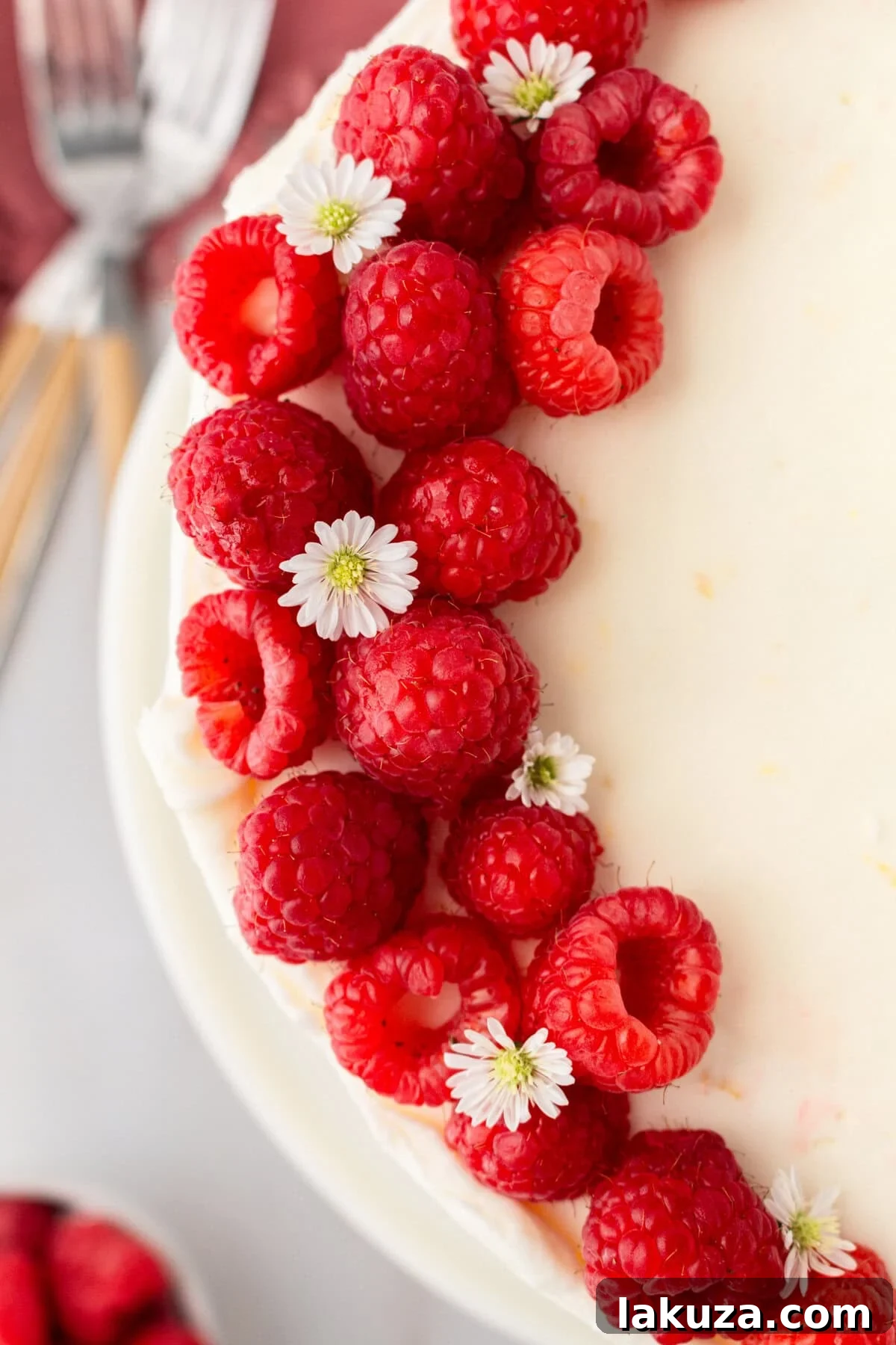 Lemon Raspberry Cake with Lemon Cream Cheese Frosting. A light and fluffy lemon cake with fresh raspberries and a fresh lemon cream cheese frosting. A sweet and tangy lemon berry cake!