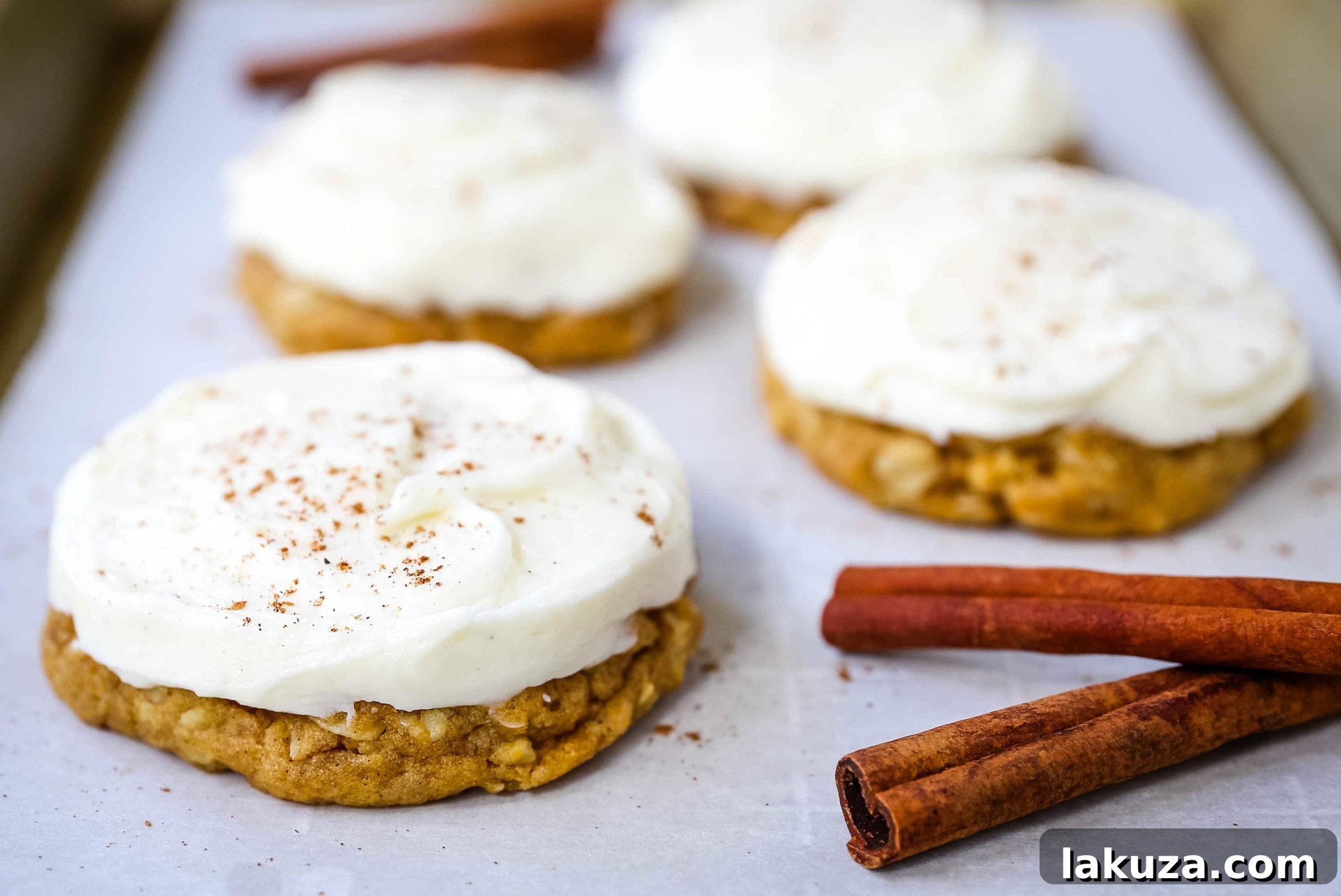 Decadent Pumpkin Cookies with Cream Cheese Frosting 2 Delicious Soft and Chewy Pumpkin Cookies with Cream Cheese Frosting, perfect for fall baking
