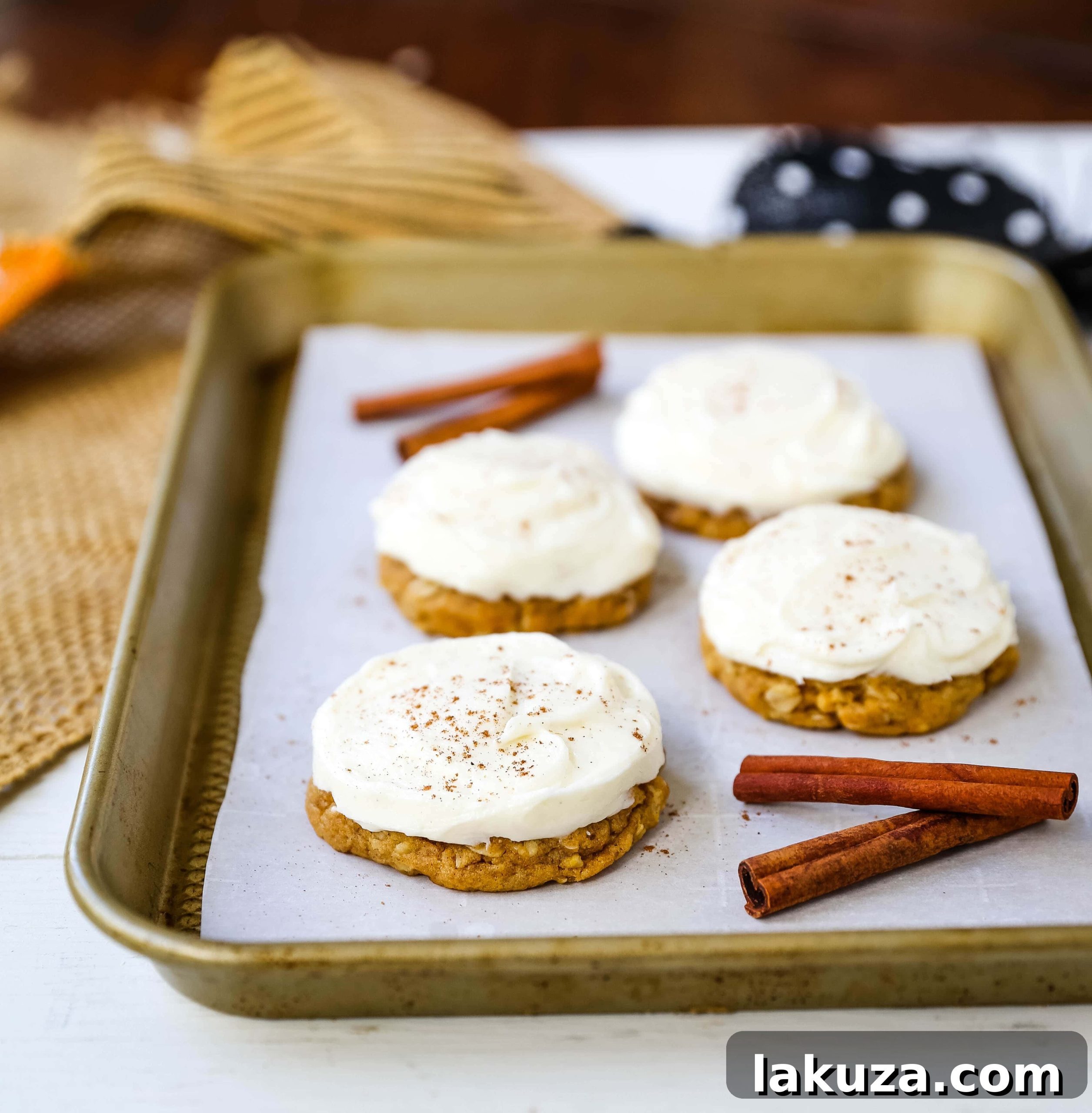 Decadent Pumpkin Cookies with Cream Cheese Frosting 5 Ingredients for cream cheese frosting laid out: butter, cream cheese, powdered sugar, vanilla