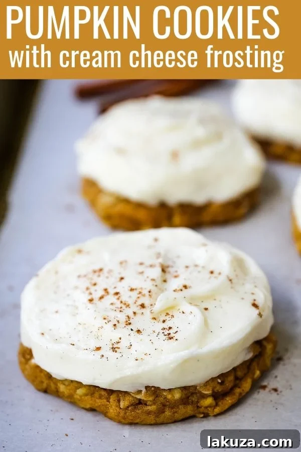 Decadent Pumpkin Cookies with Cream Cheese Frosting 7 A beautifully decorated pumpkin cookie with cream cheese frosting, ready to be served
