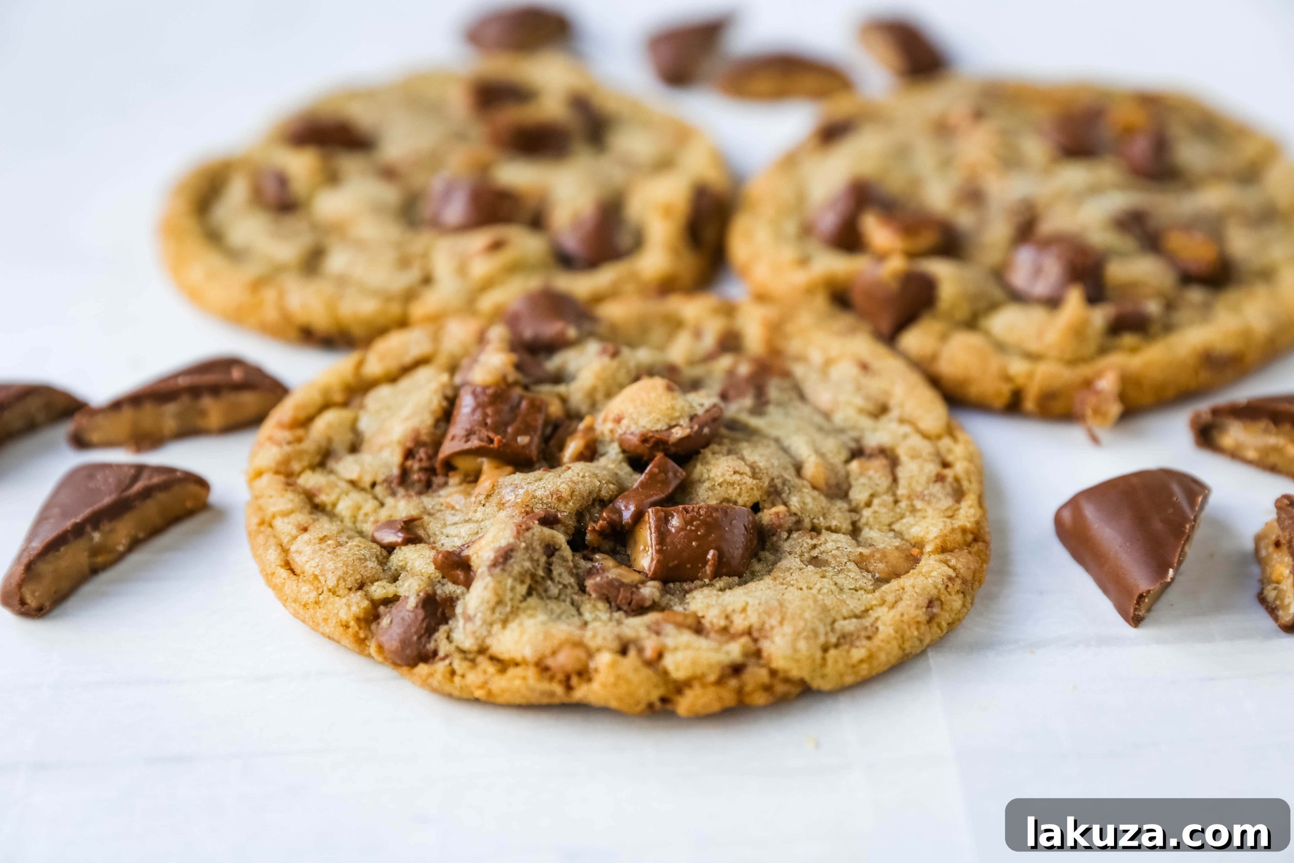 Golden Toffee Milk Chocolate Gems 6 A freshly baked batch of Milk Chocolate Toffee Cookies on a cooling rack