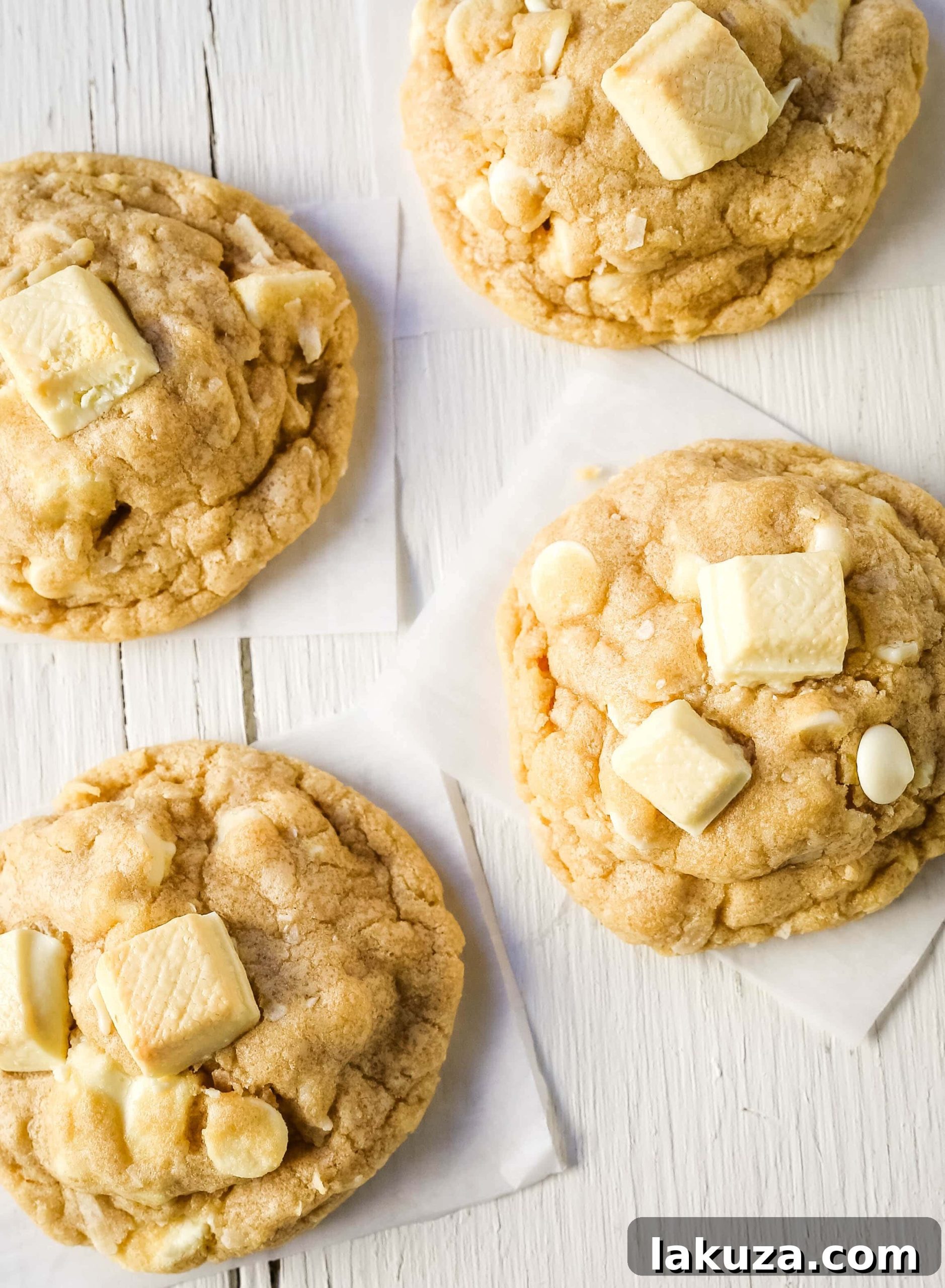 Tropical White Chocolate Coconut Delights 6 A close-up shot of a single, perfectly round White Chocolate Coconut Cookie, showcasing its rich texture and generous mix-ins.