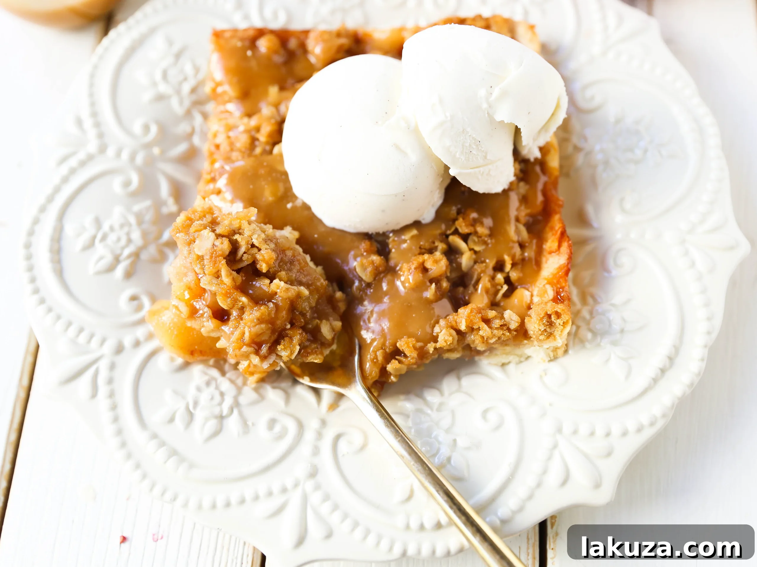 A slice of Caramel Apple Slab Pie with caramel drizzle