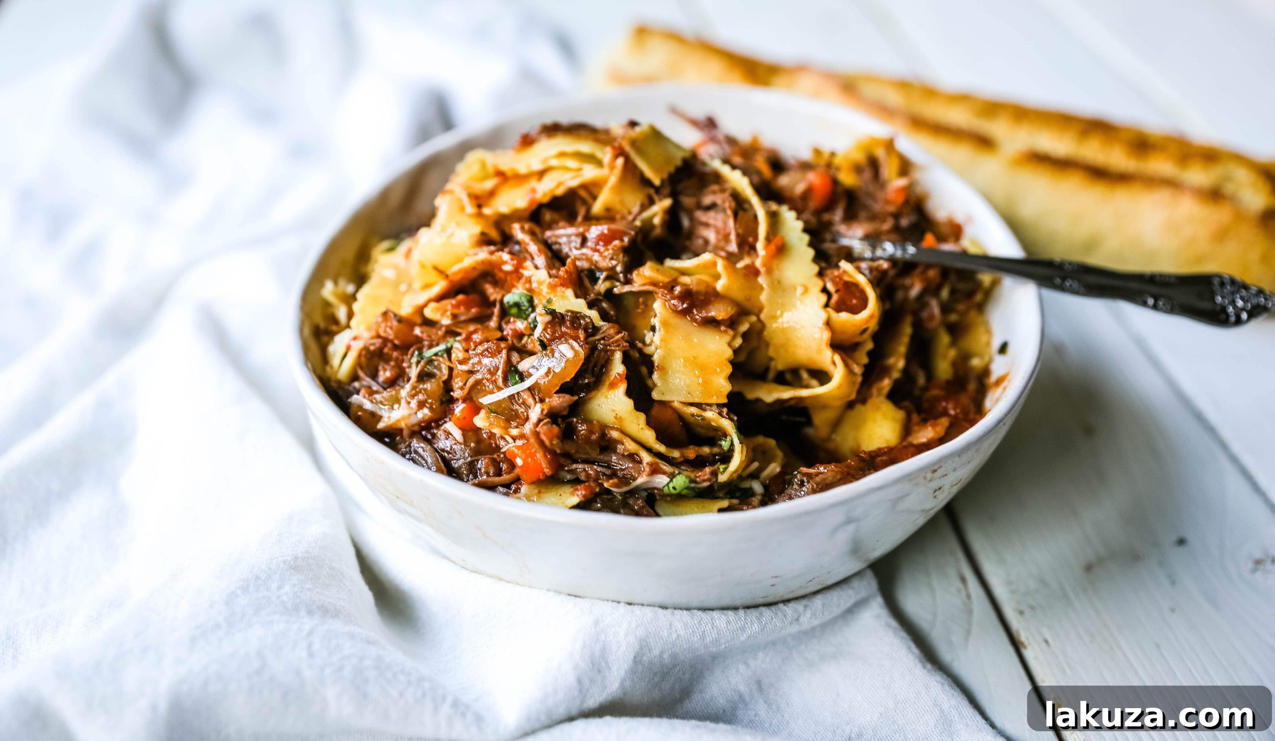 Hearty Sunday Slow Cooker Beef Ragu 4 Sunday Slow Cooker Beef Ragu. Authentic Italian Beef Ragu. The ultimate comfort food! A big bowl of slow cooked, braised beef in a rich, robust tomato sauce tossed with pasta. I guarantee that you will go back for seconds! www.modernhoney.com #slowcooker #beefragu #italianfood #italian