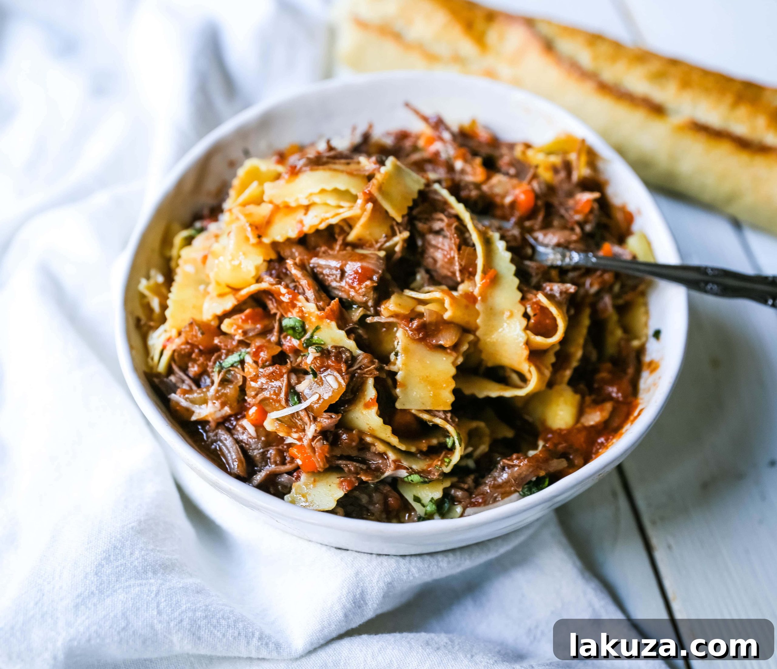 Hearty Sunday Slow Cooker Beef Ragu 5 Sunday Slow Cooker Beef Ragu. Authentic Italian Beef Ragu. The ultimate comfort food! A big bowl of slow cooked, braised beef in a rich, robust tomato sauce tossed with pasta. I guarantee that you will go back for seconds! www.modernhoney.com #slowcooker #beefragu #italianfood #italian