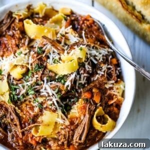 Hearty Sunday Slow Cooker Beef Ragu 8 Sunday Slow Cooker Beef Ragu. Authentic Italian Beef Ragu. The ultimate comfort food! A big bowl of slow cooked, braised beef in a rich, robust tomato sauce tossed with pasta. I guarantee that you will go back for seconds! www.modernhoney.com #slowcooker #beefragu #italianfood #italian