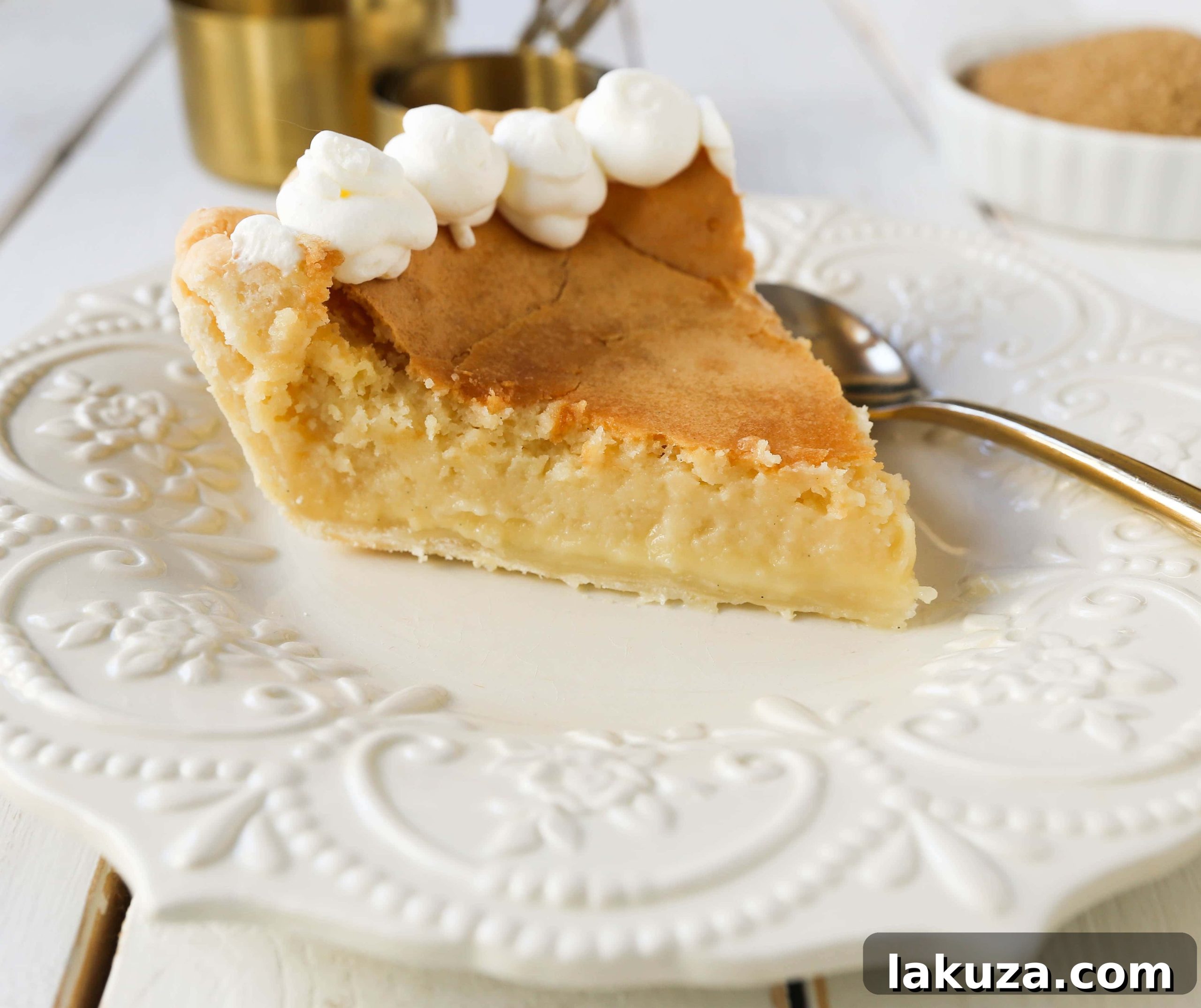 Crisp Caramel Custard Pie 2 Creme Brûlée Pie. A silky smooth vanilla custard in a buttery crust topped with a crisp sugar topping. It is a creamy sweet pie with a touch of tang and will be everyone's favorite pie! www.modernhoney.com #thanksgiving #pie #pies #thanksgivingrecipes #cremebrulee