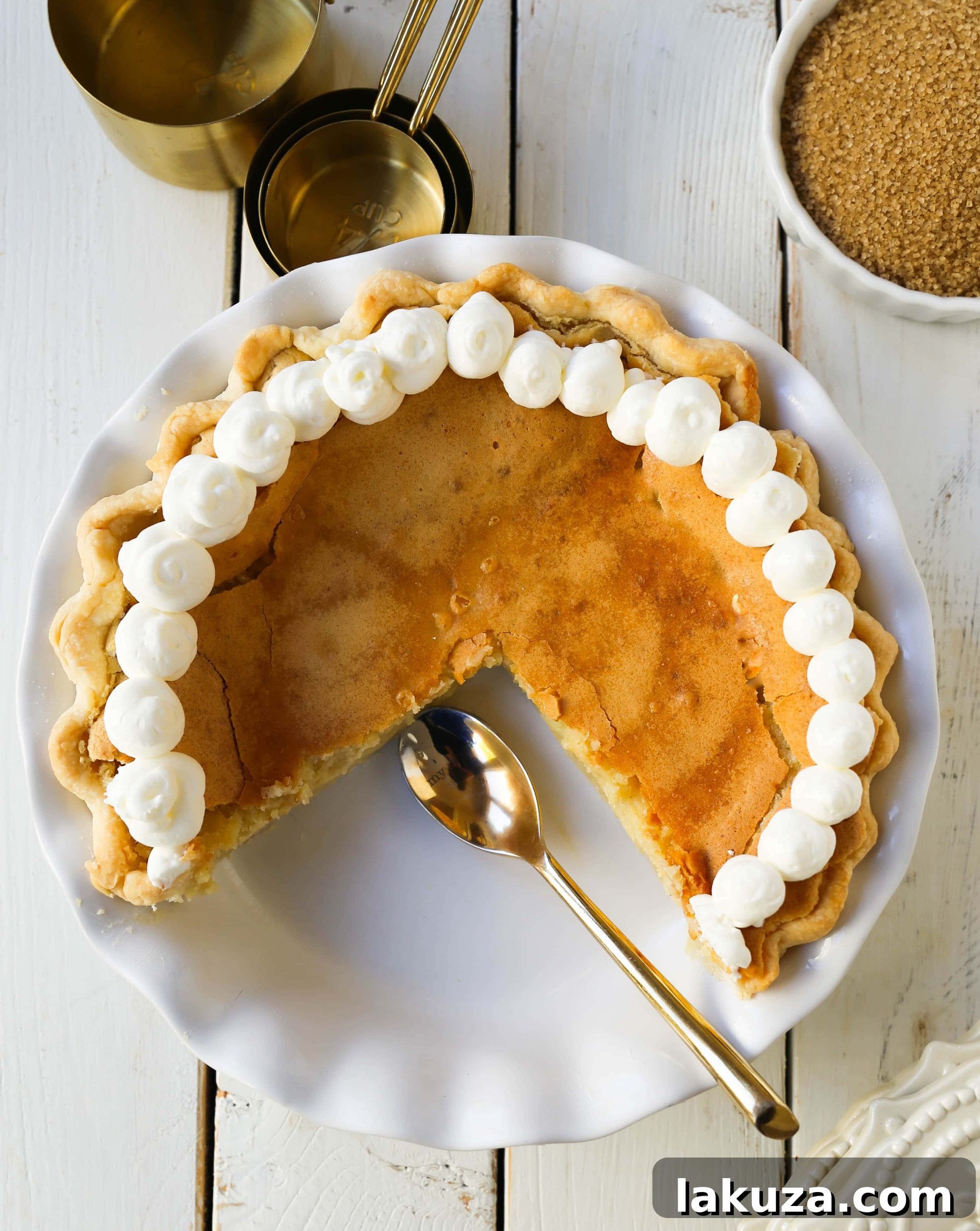 Crisp Caramel Custard Pie 5 Creme Brûlée Pie. A silky smooth vanilla custard in a buttery crust topped with a crisp sugar topping. It is a creamy sweet pie with a touch of tang and will be everyone's favorite pie! www.modernhoney.com #thanksgiving #pie #pies #thanksgivingrecipes #cremebrulee