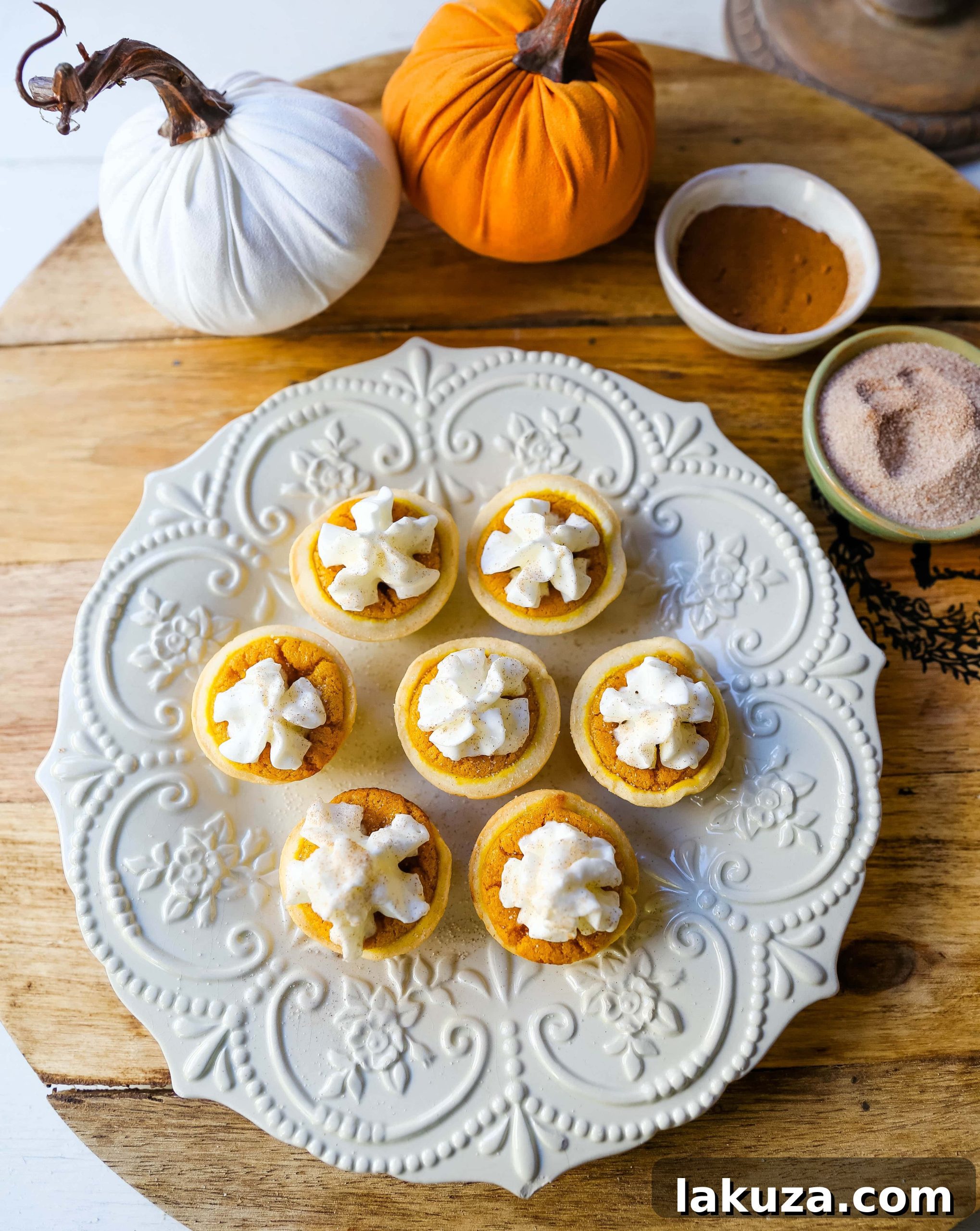 Pumpkin Pie Poppers 3 Close-up of Mini Pumpkin Pie Bites, showcasing their perfect size, golden crust, and creamy filling, ready for holiday parties and dessert tables.