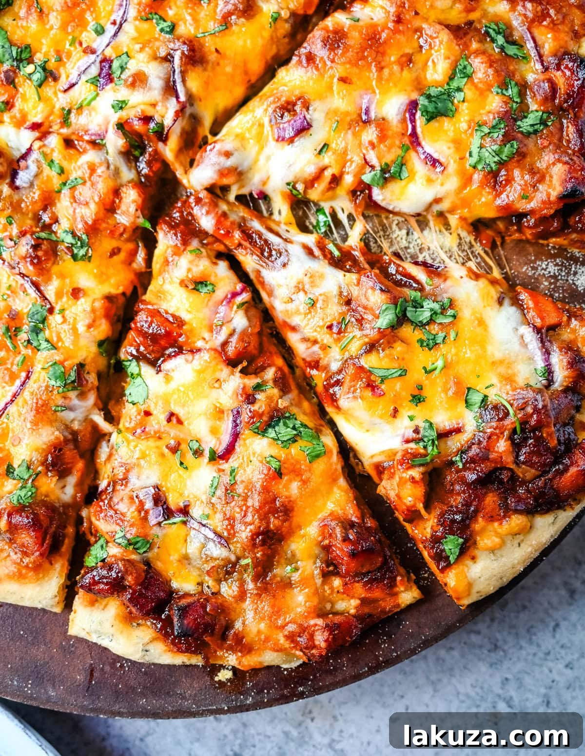 Gourmet BBQ Chicken Pizza at Home 3 Close-up of a Homemade BBQ Chicken Pizza, showcasing the bubbly cheese and fresh ingredients.