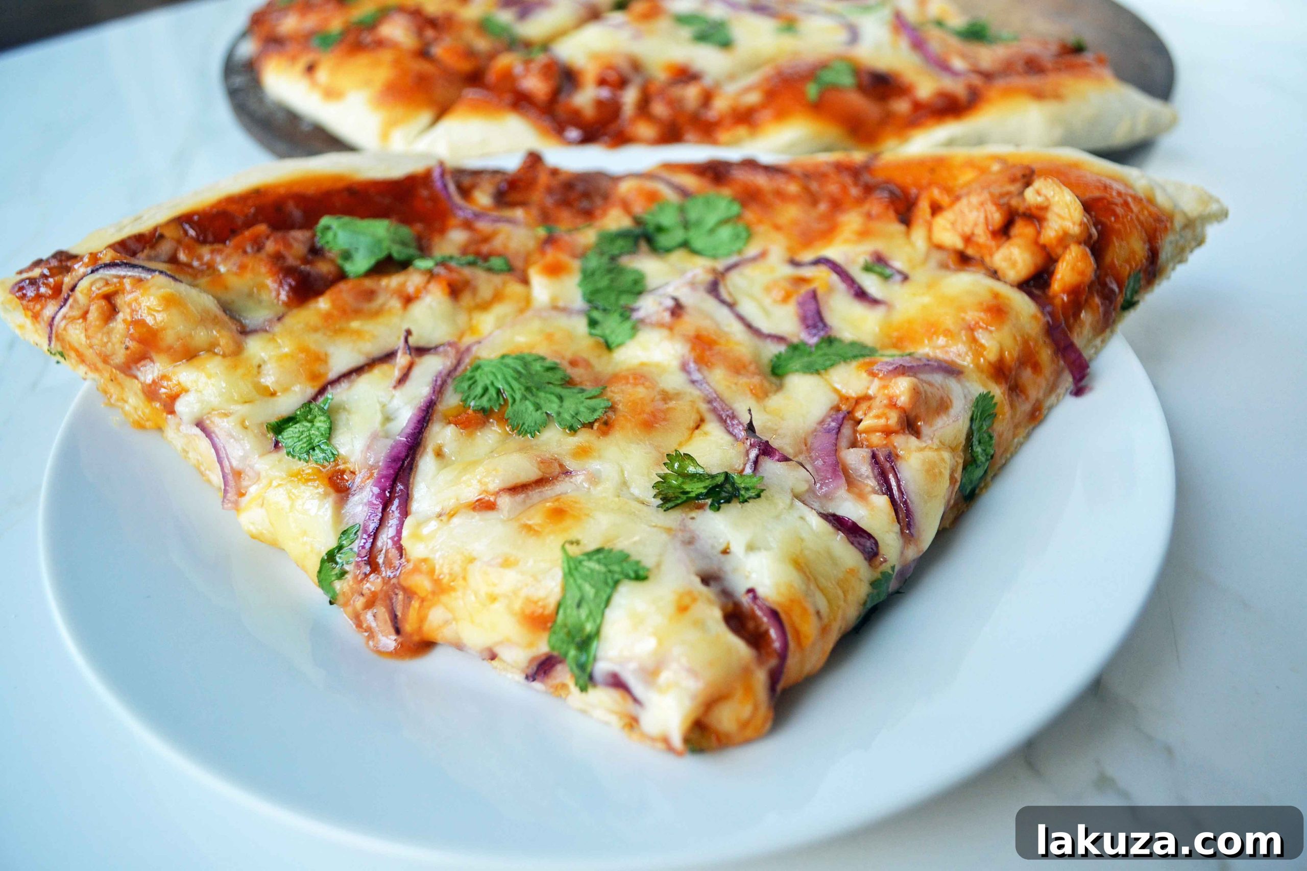 Gourmet BBQ Chicken Pizza at Home 9 A close-up of the delicious BBQ Chicken Pizza, freshly baked with melted cheese and crisp toppings.