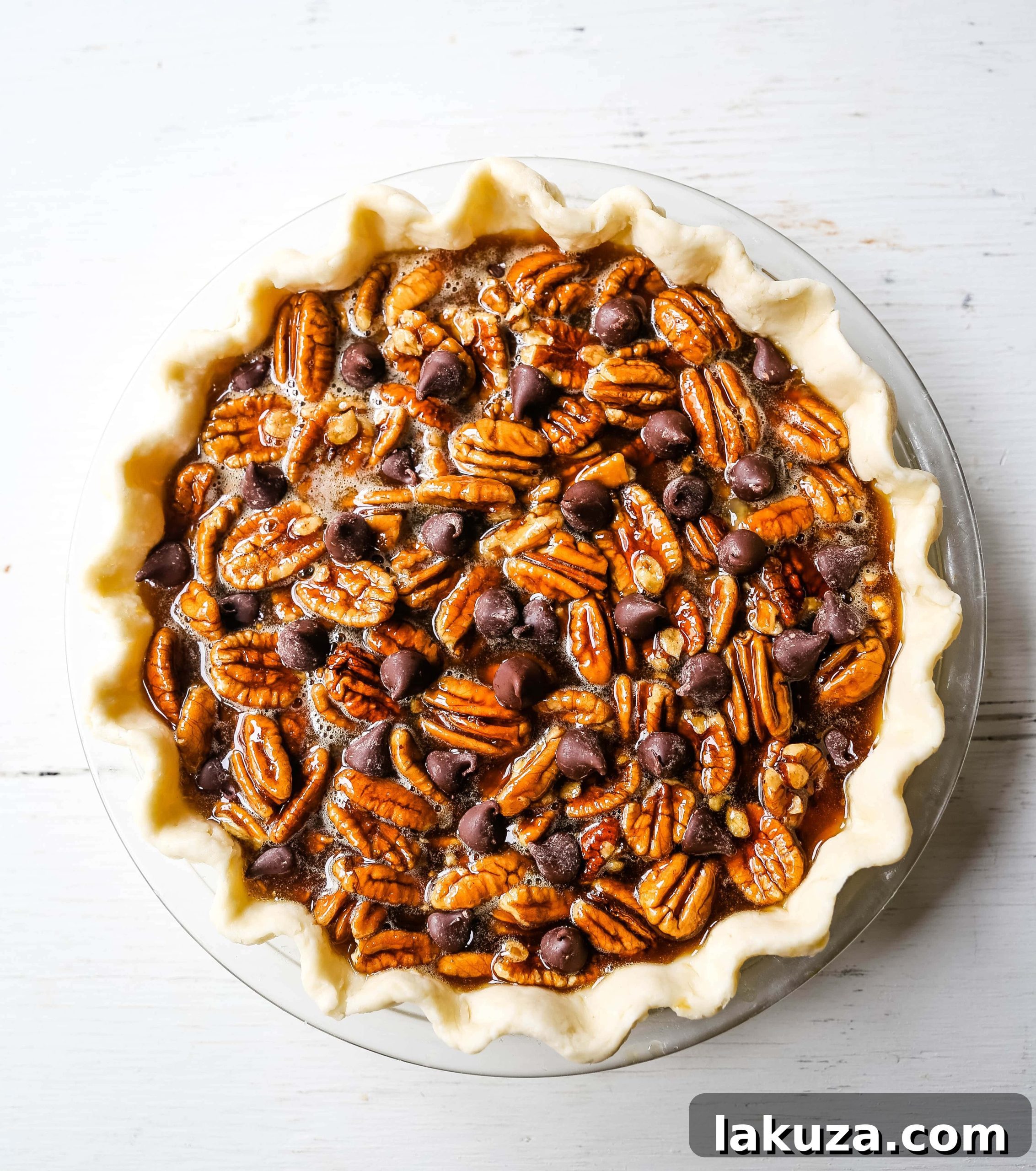 Overhead view of a whole Chocolate Pecan Pie, glistening and ready to serve