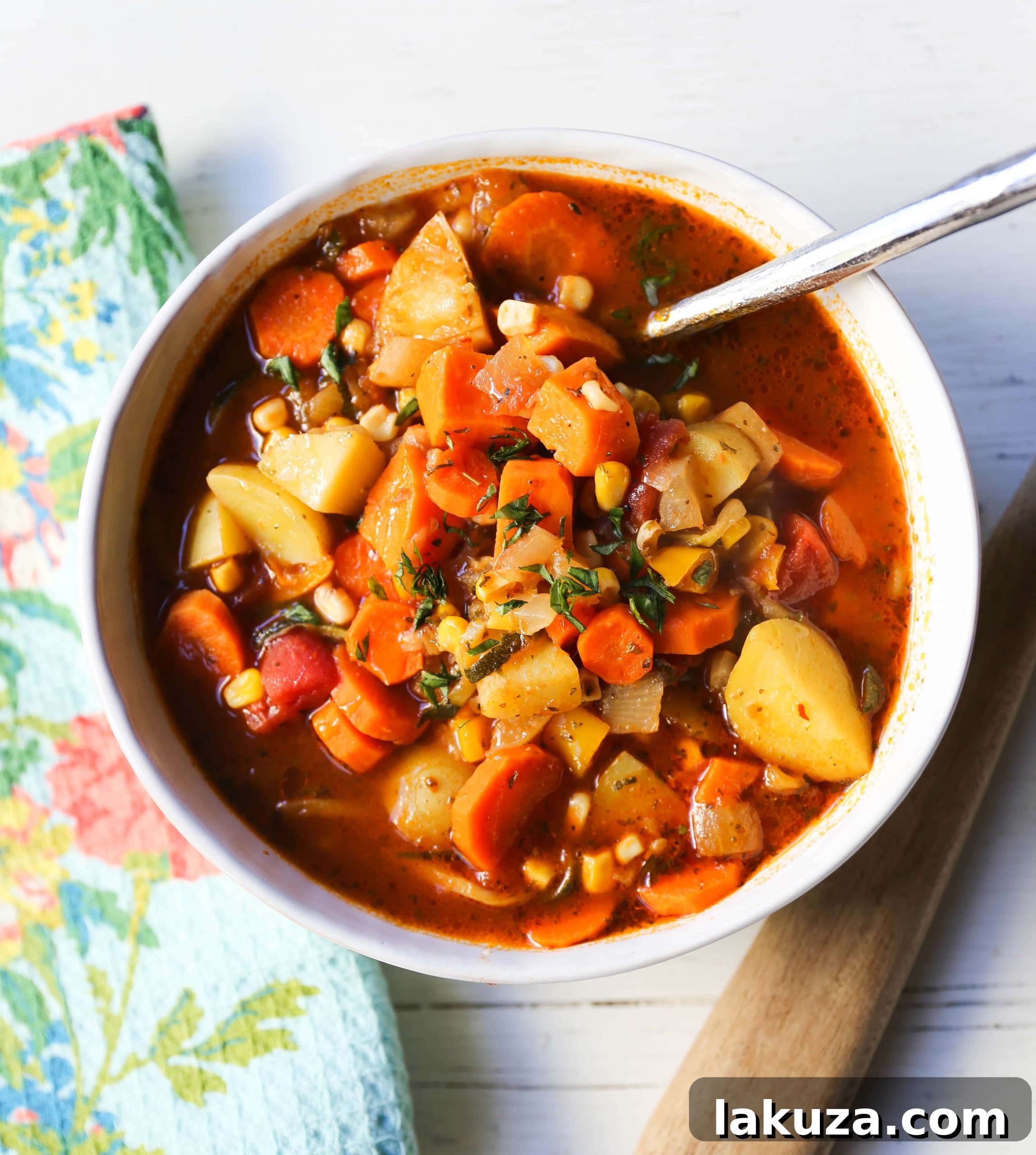 Nutrient-Rich Reset Soup 2 Detox Vegetable Soup with fresh vegetables and herbs, steaming in a rustic bowl. A perfect healthy meal for post-holiday rejuvenation.