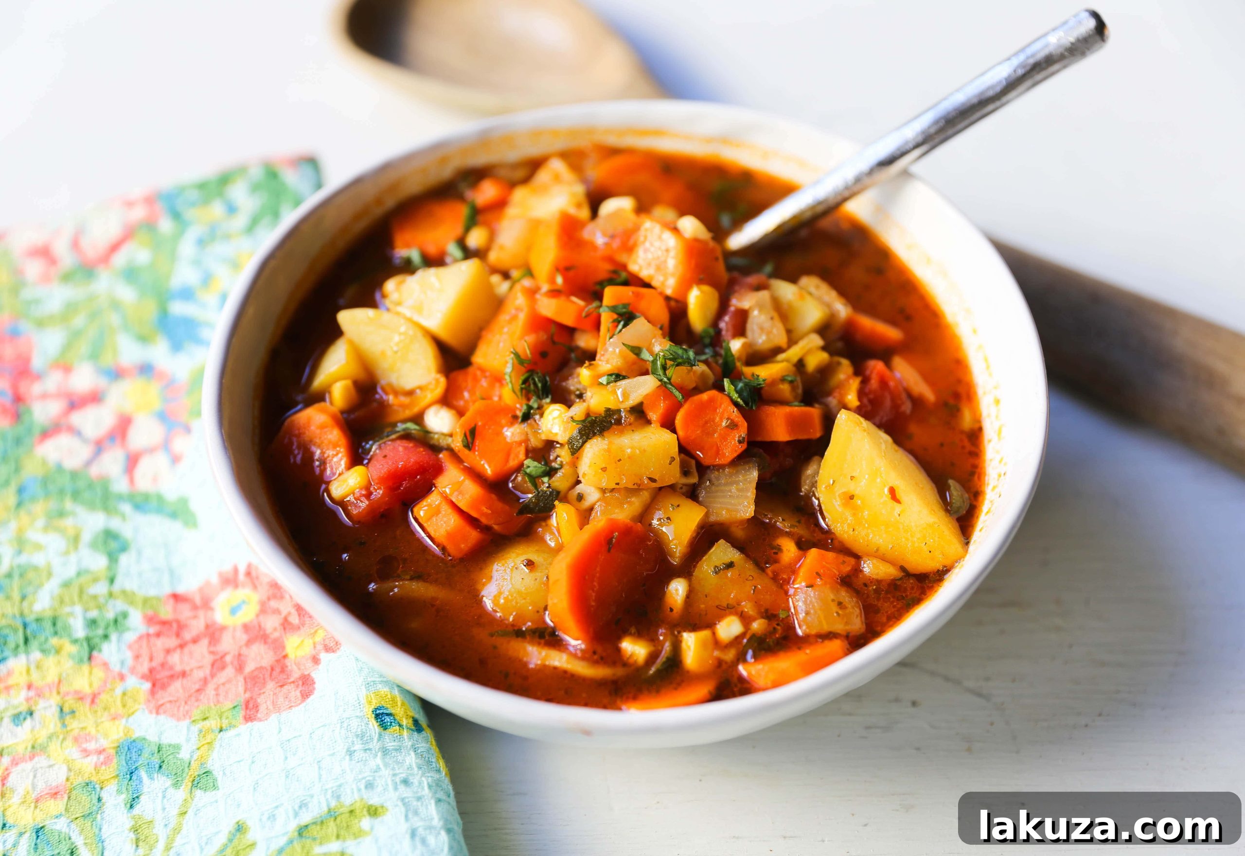 Nutrient-Rich Reset Soup 3 A vibrant bowl of homemade vegetable soup with a medley of colorful chopped vegetables, ready to be enjoyed.
