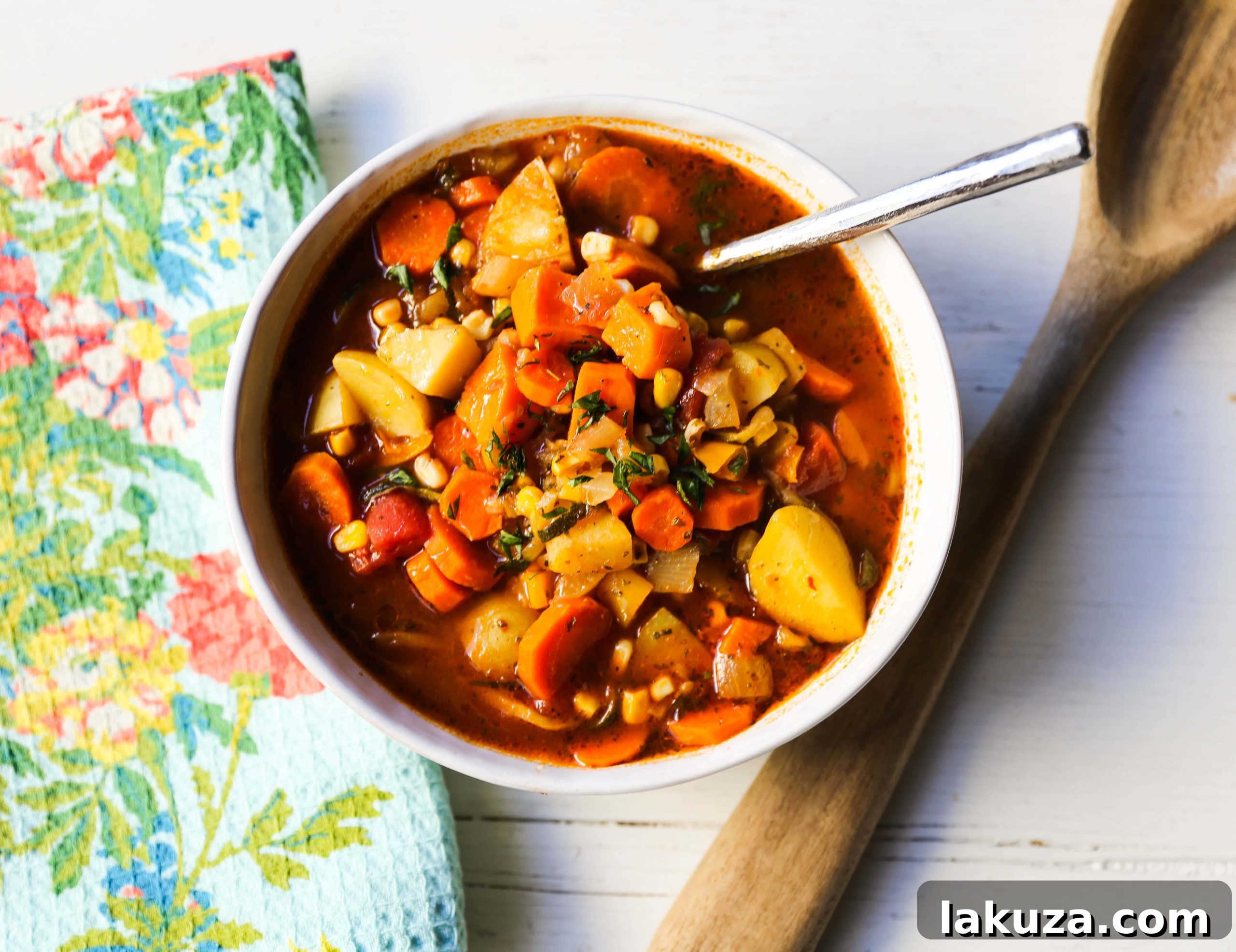 Nutrient-Rich Reset Soup 4 Freshly chopped vegetables including carrots, potatoes, zucchini, and corn, prepared for a delicious homemade soup.