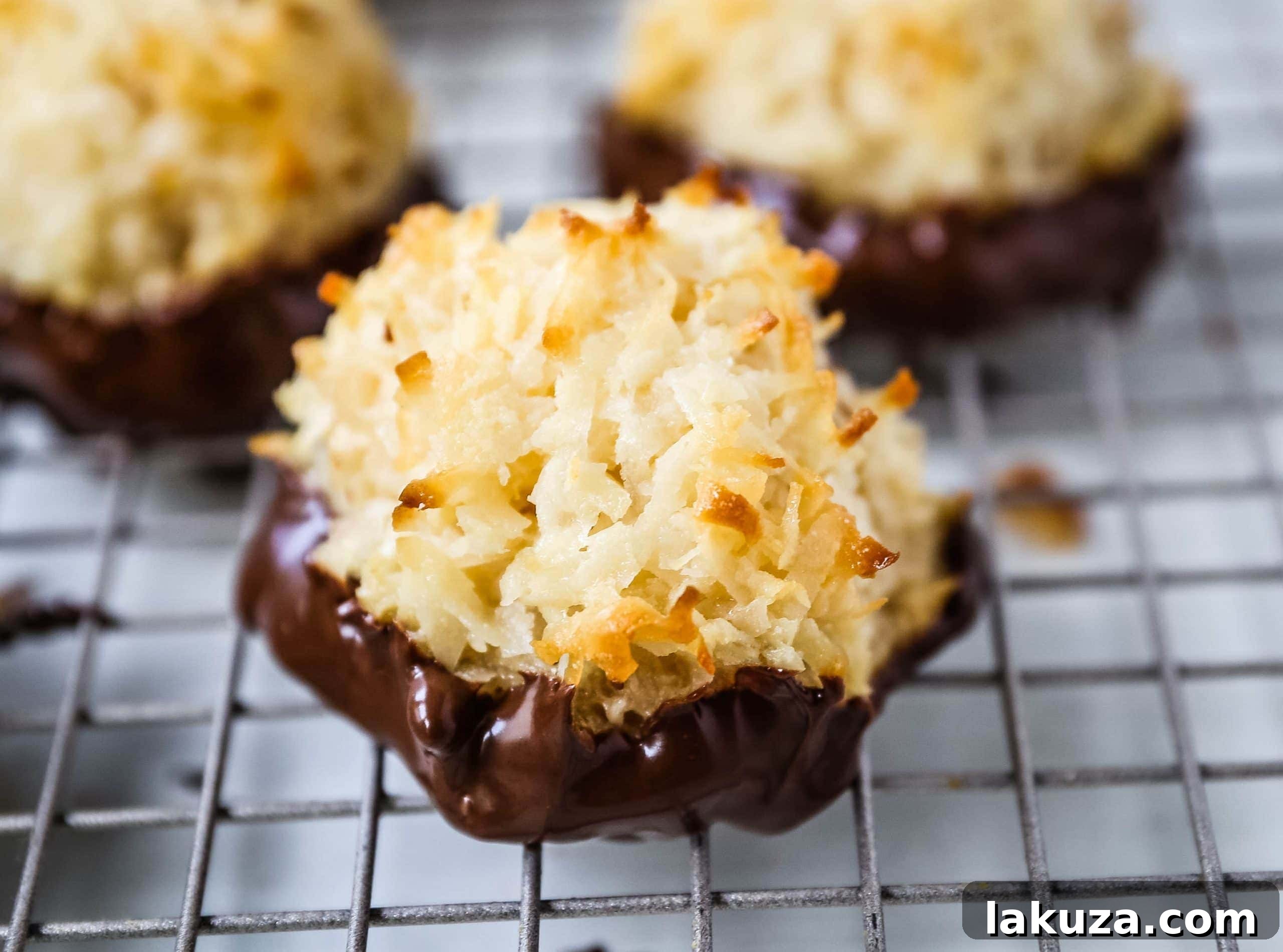 The Best Coconut Macaroons. Soft chewy sweet coconut macaroons are the perfect gluten-free cookie. How to make the perfect coconut macaroons dipped in dark chocolate. Modern Honey recipe for delightful coconut treats.