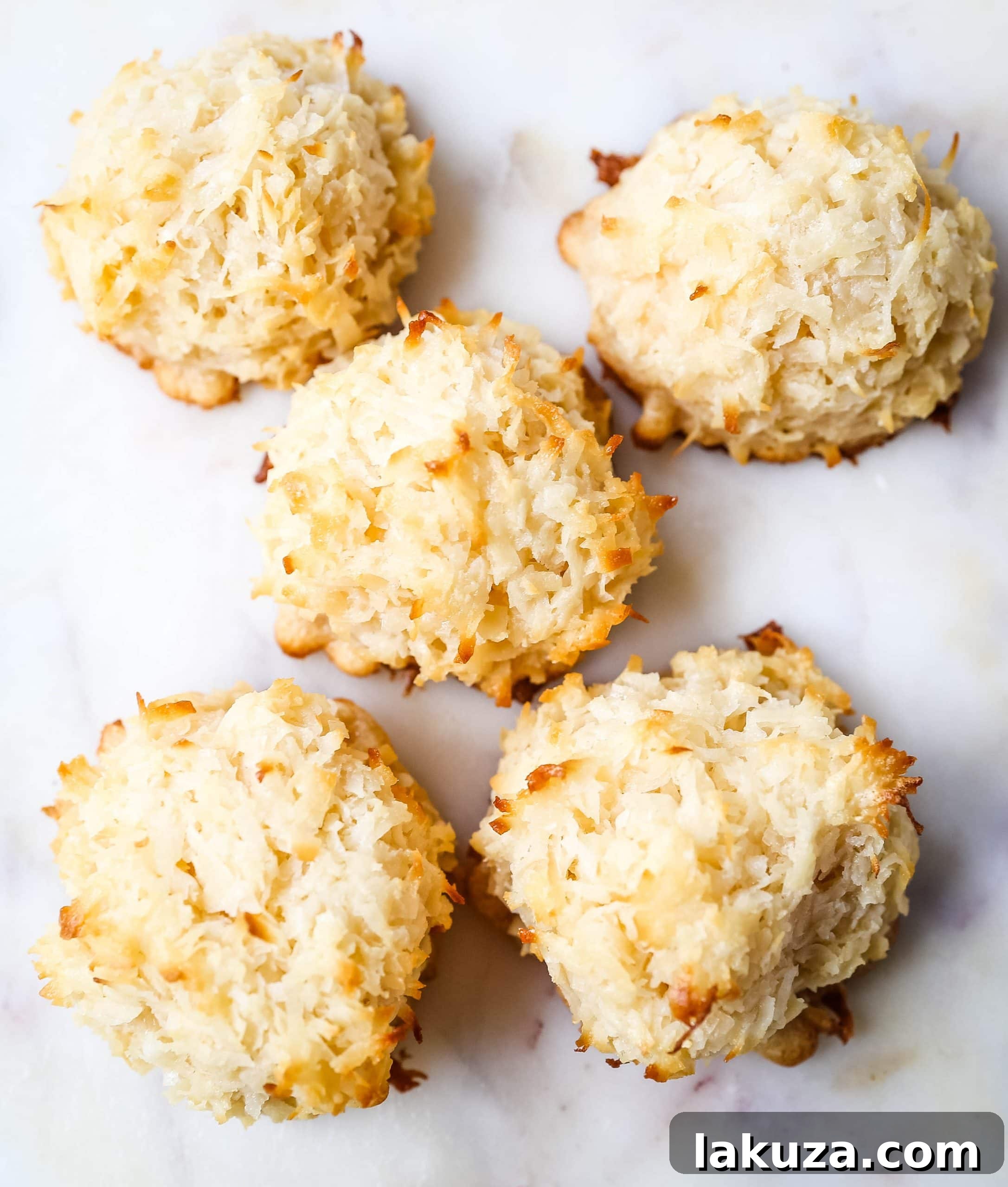 Deliciously soft and chewy coconut macaroons, a perfect gluten-free cookie option. Learn to make these sweet treats, optionally dipped in rich dark chocolate, for any occasion.