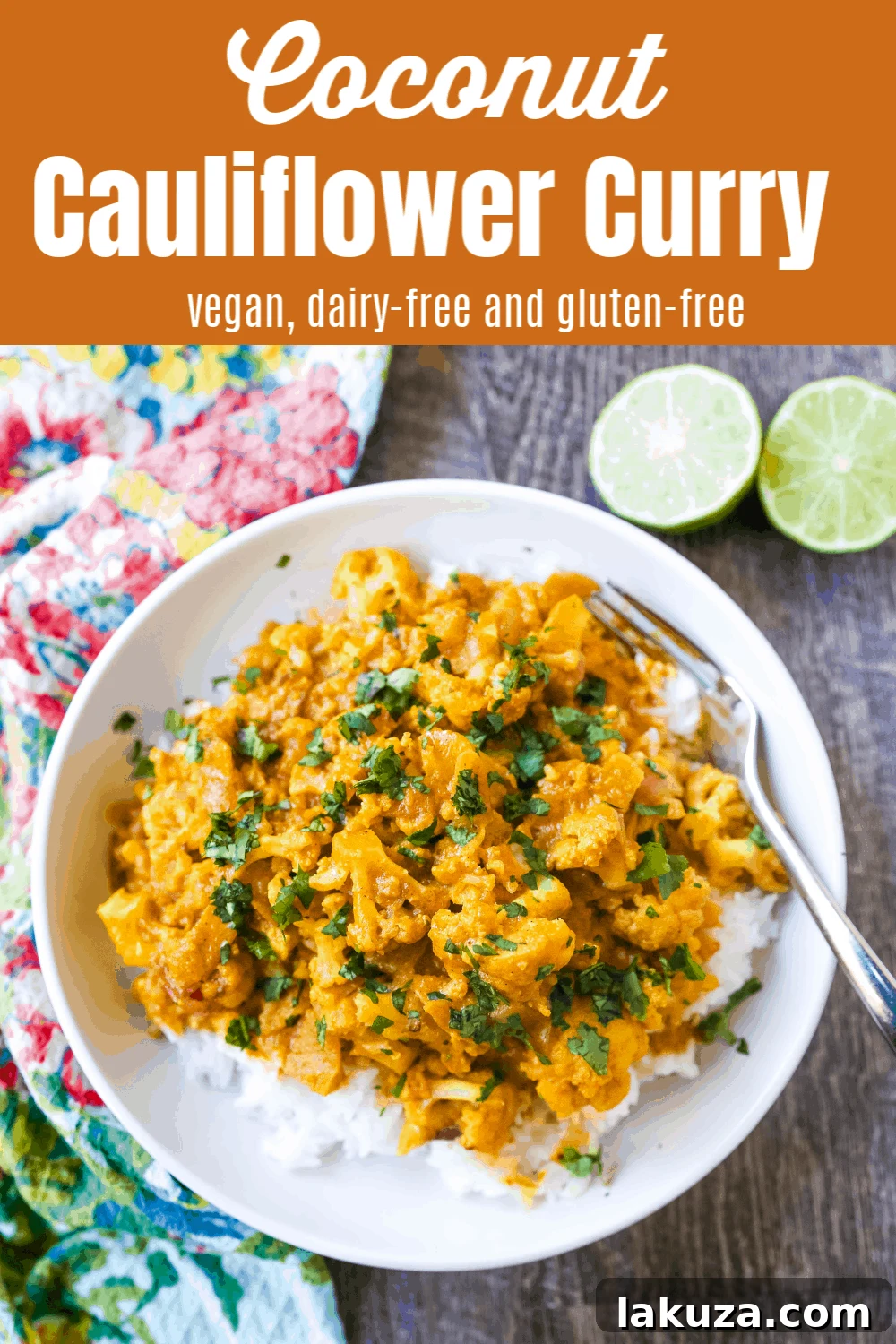 A beautifully plated bowl of Coconut Cauliflower Curry, garnished with fresh cilantro and a lime wedge, ready to be enjoyed.