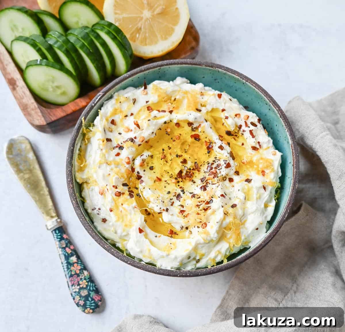Simple and creamy whipped feta cheese dip is the perfect appetizer! Mediterranean feta cheese is whipped with cream cheese, a touch of mayo, lemon zest, and warm spices. Fresh and tangy, it pairs perfectly with warm pita bread and veggies!