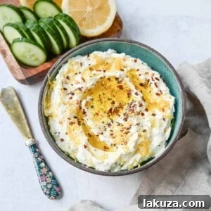 Simple and creamy whipped feta cheese dip is the perfect appetizer! Mediterranean feta cheese is whipped with cream cheese, a touch of mayo, lemon zest, and warm spices. Fresh and tangy, it pairs perfectly with warm pita bread and veggies!