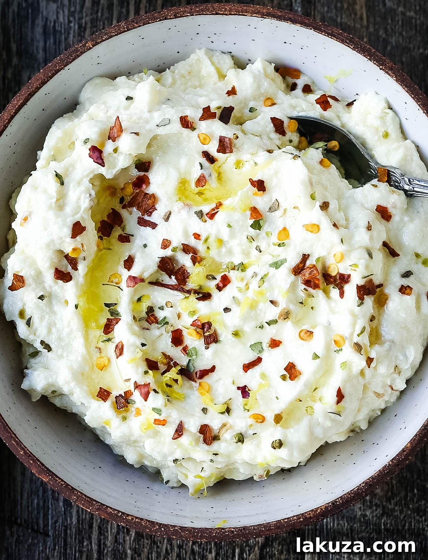Mediterranean Creamy Feta Cheese Dip A creamy feta cheese dip with extra-virgin olive oil, feta cheese, cream cheese, garlic, fresh lemon zest, and red chili flakes. www.modernhoney.com #dip #dips #appetizer #appetizers #fetadip #fetacheesedip #superbowl