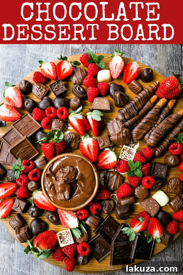 Decadent Chocolate Spread 6 A vibrant and indulgent chocolate dessert board, featuring an array of chocolates, fresh berries, and a creamy Nutella dip, ready to be enjoyed.