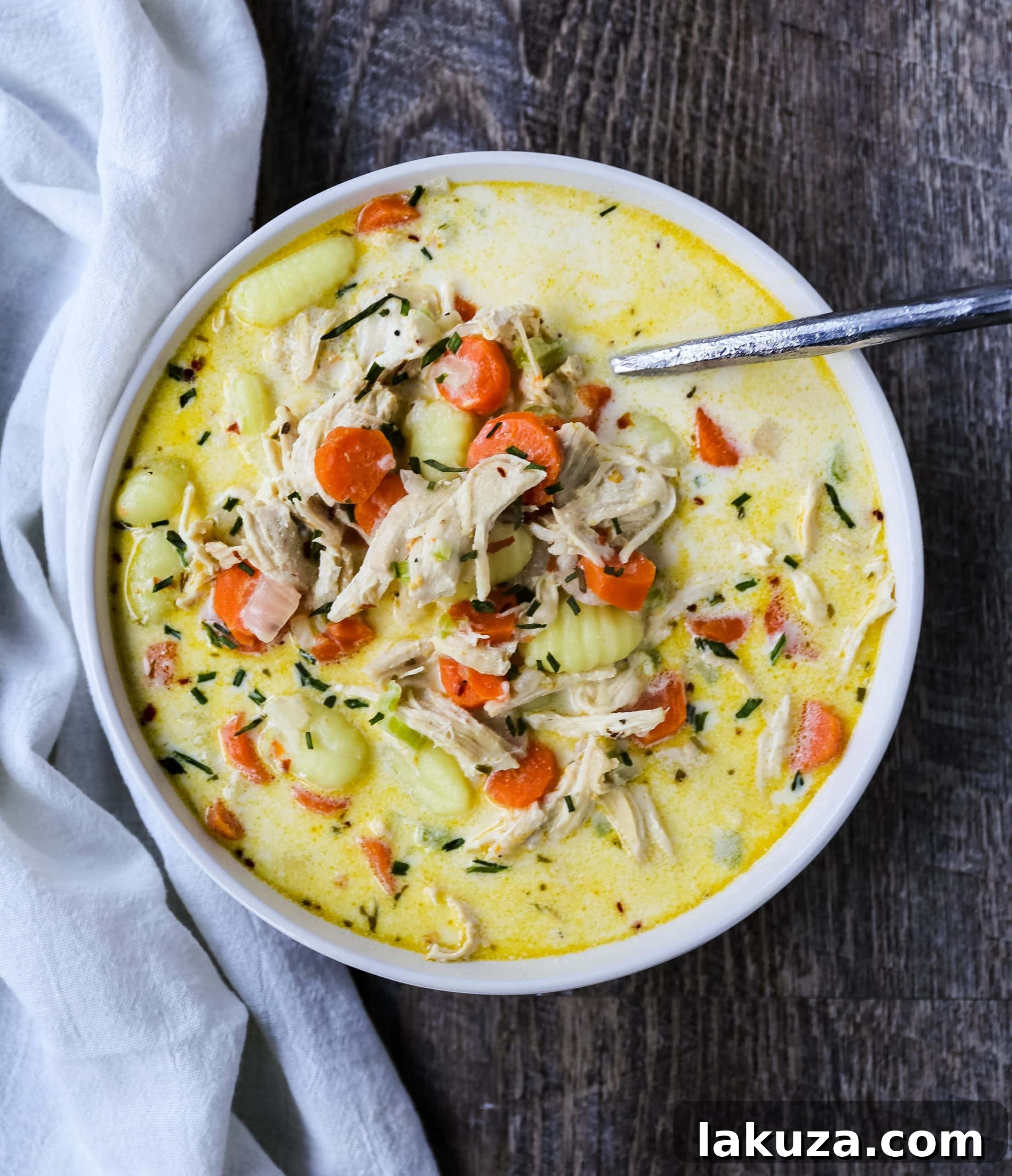 Creamy Gnocchi Chicken Soup - A warm, comforting bowl of creamy chicken and vegetable soup featuring soft gnocchi pasta in a rich parmesan broth.