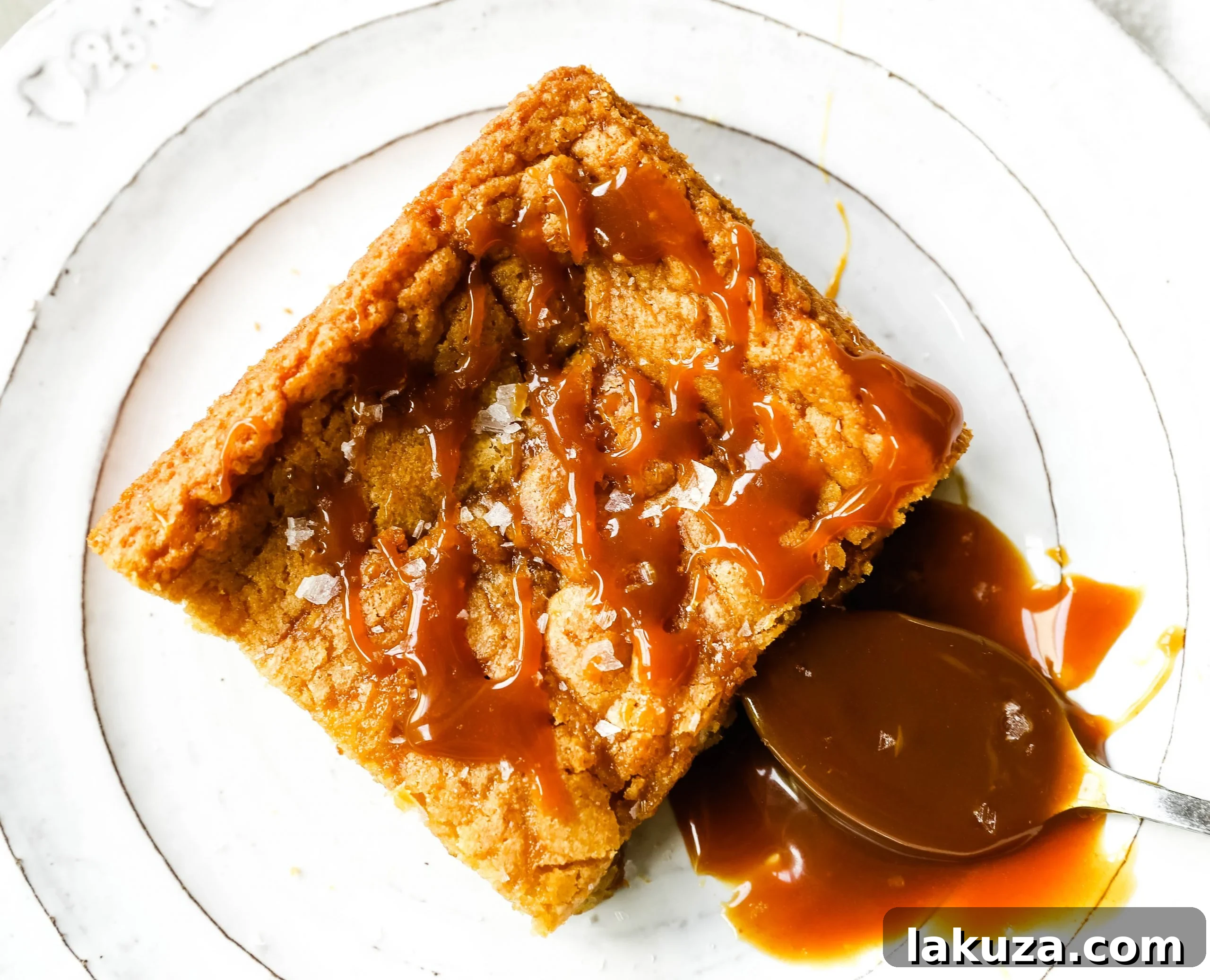 Salted Caramel Blondie Bliss 2 Soft chewy vanilla blondies swirled with rich salted caramel and baked until golden brown. The Best Sea Salt Caramel Blondies recipe for a perfect sweet and salty dessert bar.