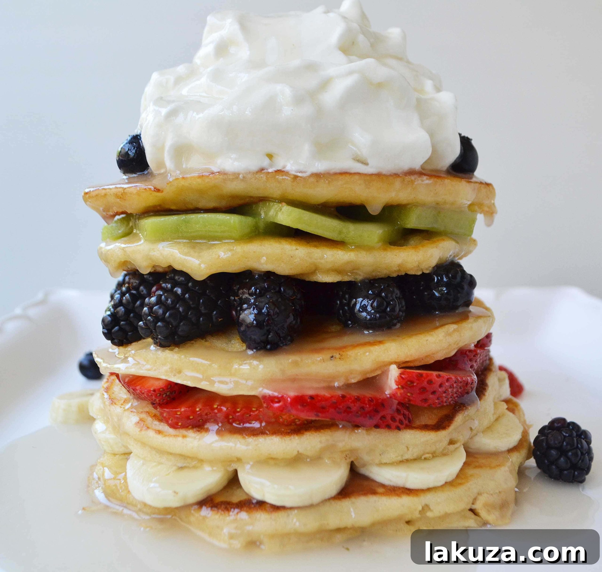 Fruit Pancake Stack with Coconut Syrup and Freshly Whipped Cream by Modern Honey
