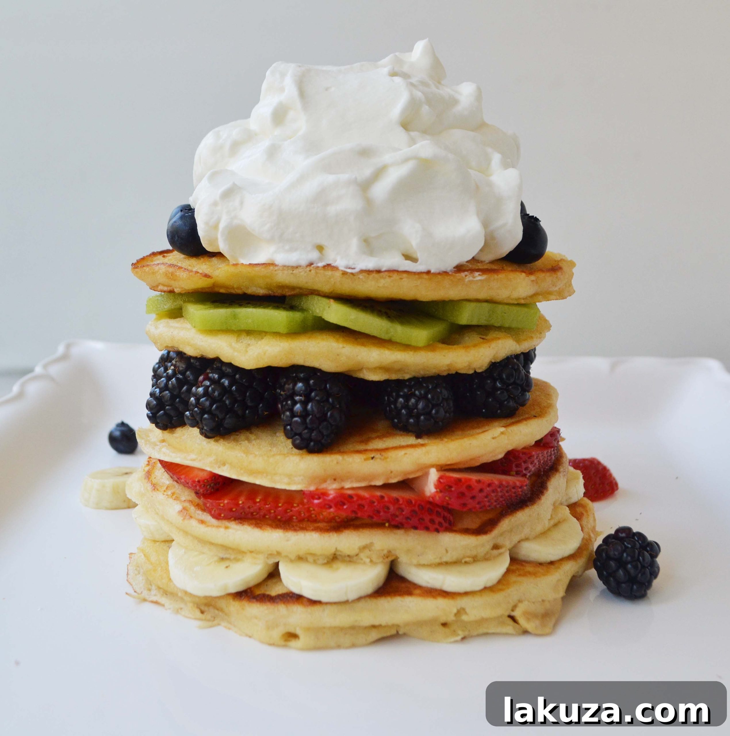 Fresh Fruit Pancake Stack with Coconut Syrup, a family favorite