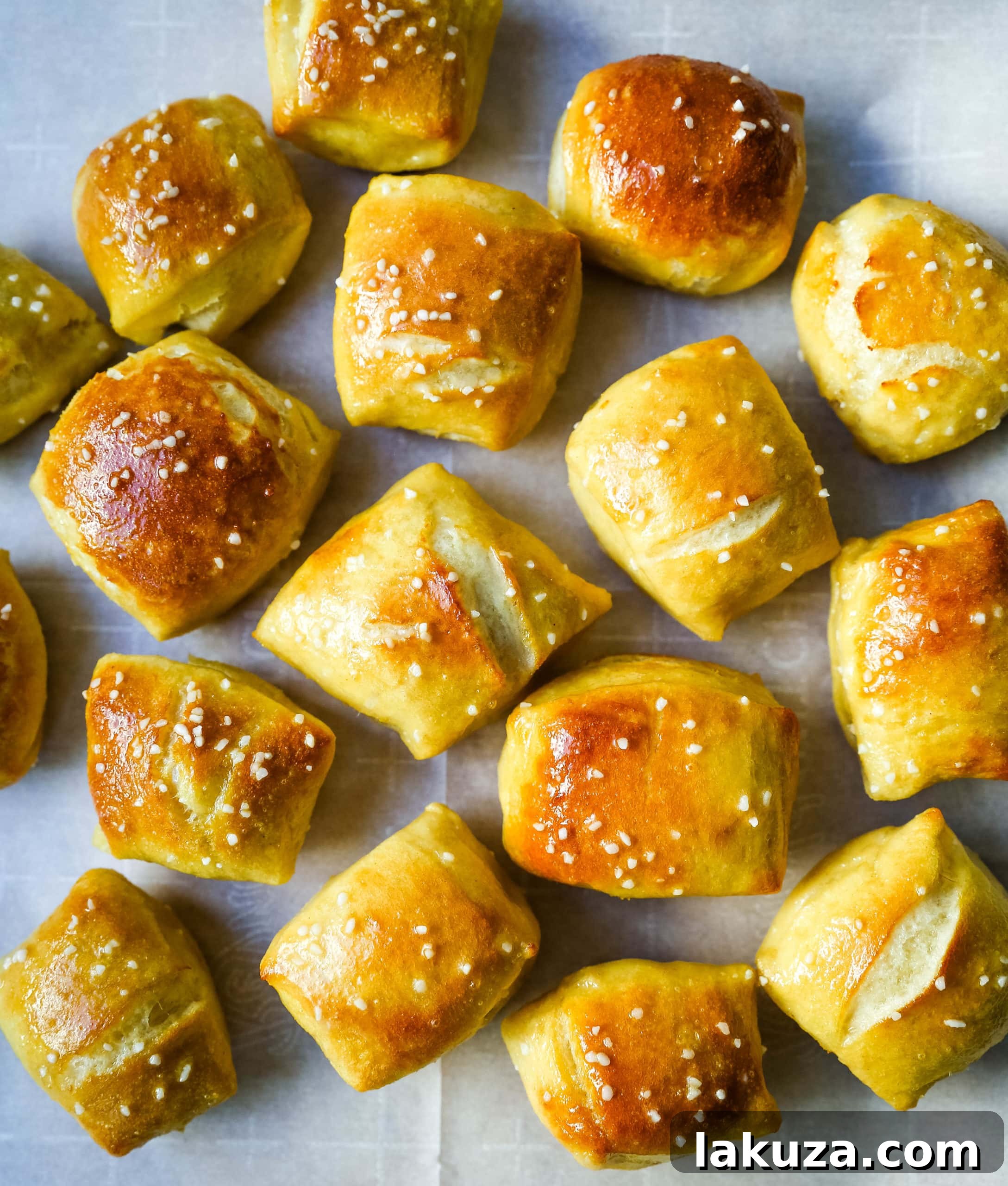 Close-up of freshly baked pretzel bites with a glistening buttery sheen, ready for enjoyment.