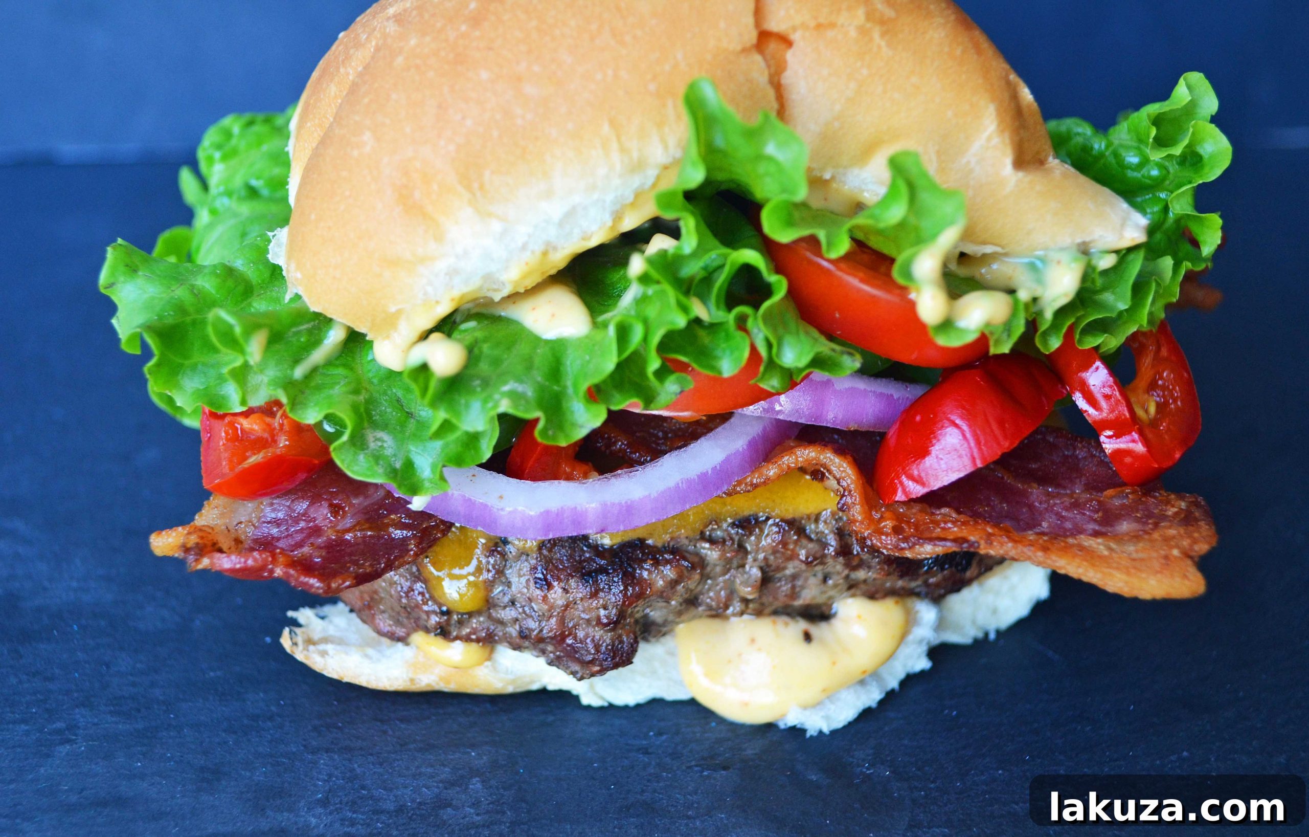 Arizona Blast Burger 5 A perfectly grilled Arizona Bombshell Burger patty topped with melted cheddar cheese and crispy bacon