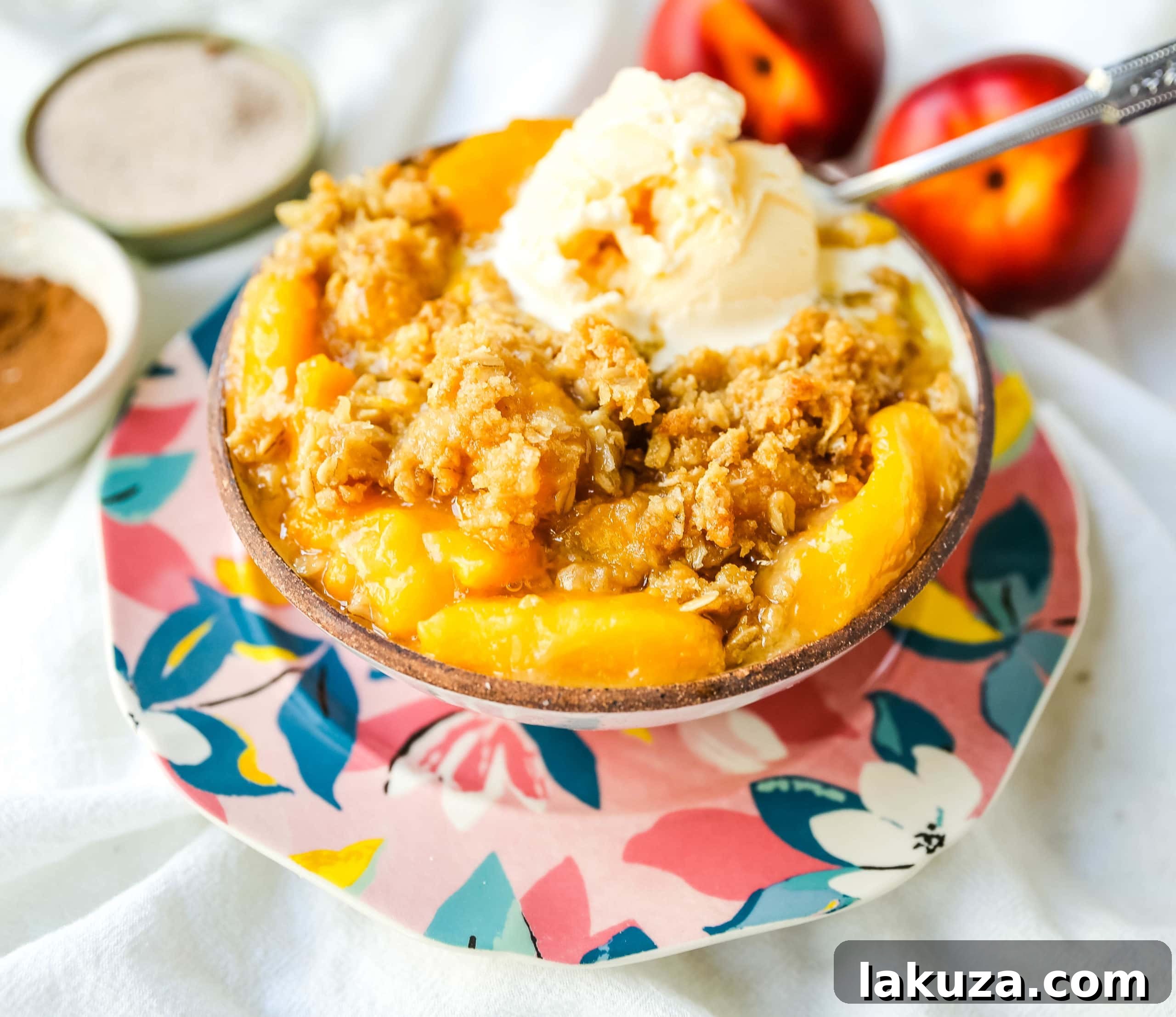 Golden Peach Delight 3 Homemade Peach Crisp with a golden brown sugar oat topping, ready to be served. A delicious and simple peach recipe.