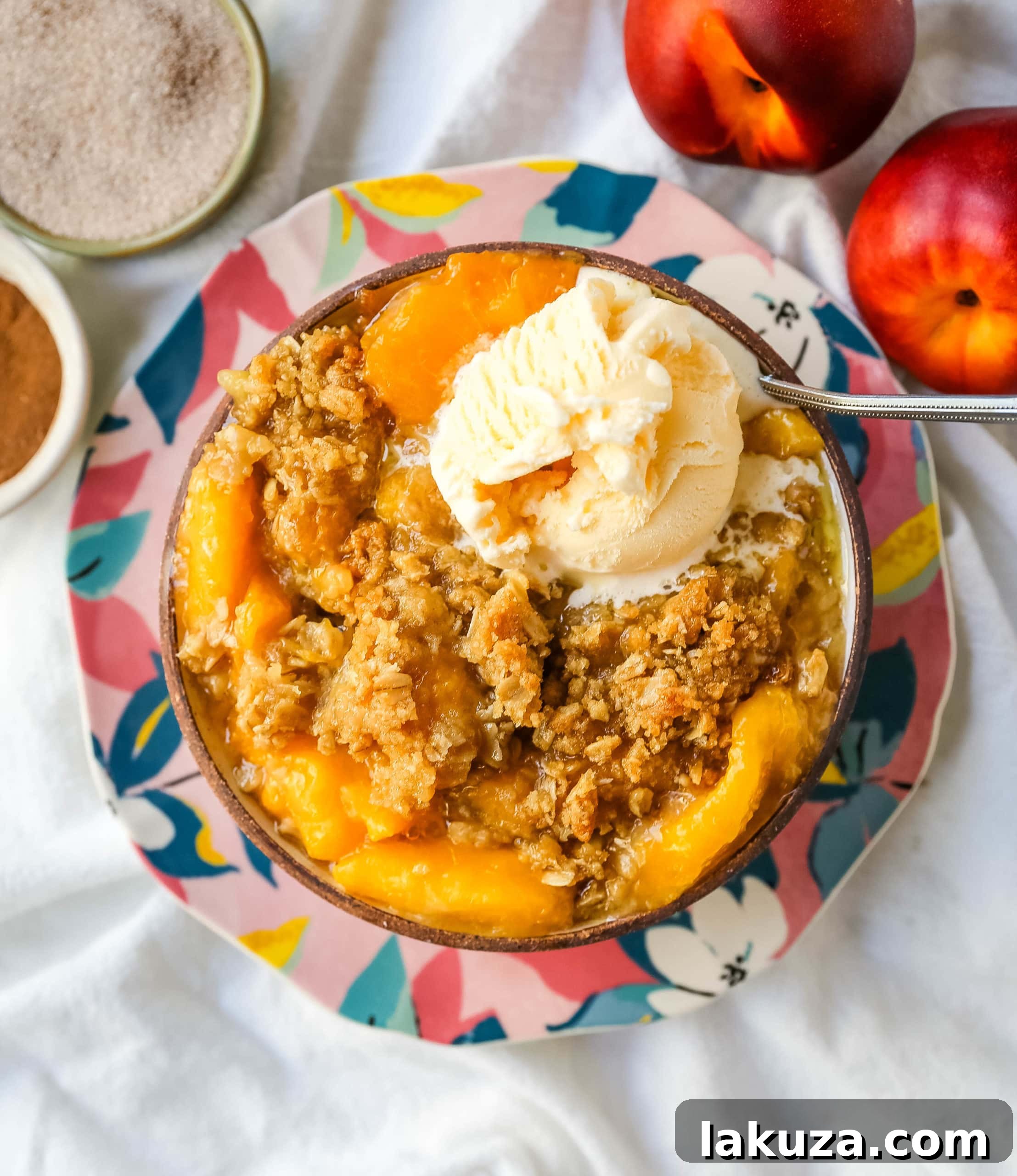 Golden Peach Delight 5 Scoops of Peach Crisp with melted vanilla ice cream, showing the warm fruit and crunchy topping.