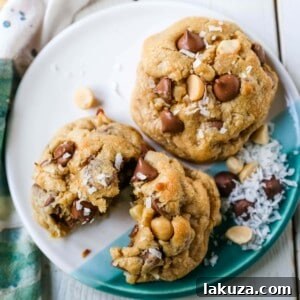 Irresistible Milk Chocolate Macadamia Coconut Cookies 8 Milk Chocolate Chip Macadamia Nut Coconut Cookies Thick soft and chewy bakery-style milk chocolate chip macadamia nut coconut cookies are an Island favorite!