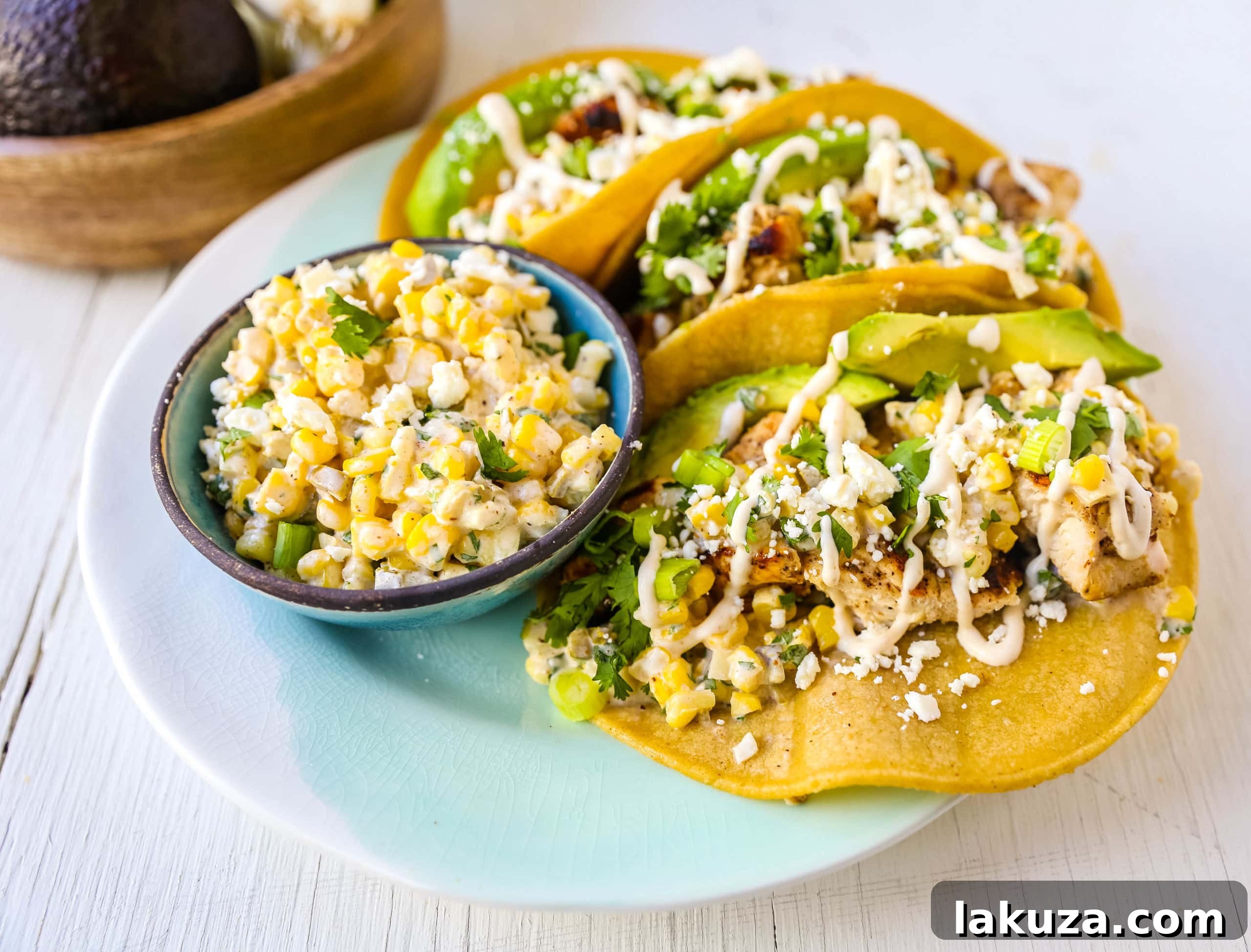 Close-up of grilled chicken and vibrant street corn salsa for tacos