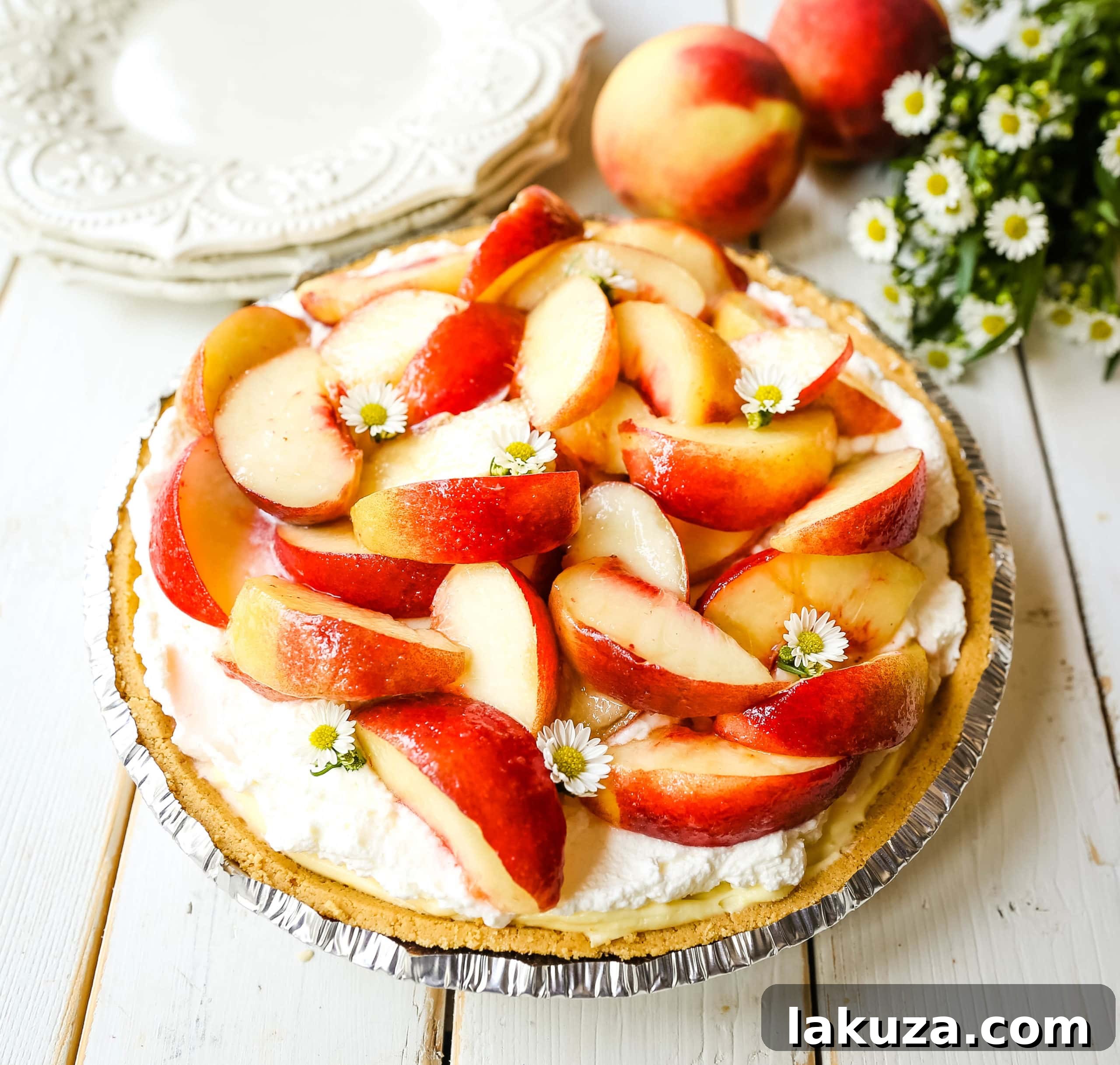 A close-up view of the rich, creamy vanilla filling in the Peaches and Cream Pie, showcasing its smooth texture before the peach topping is added.