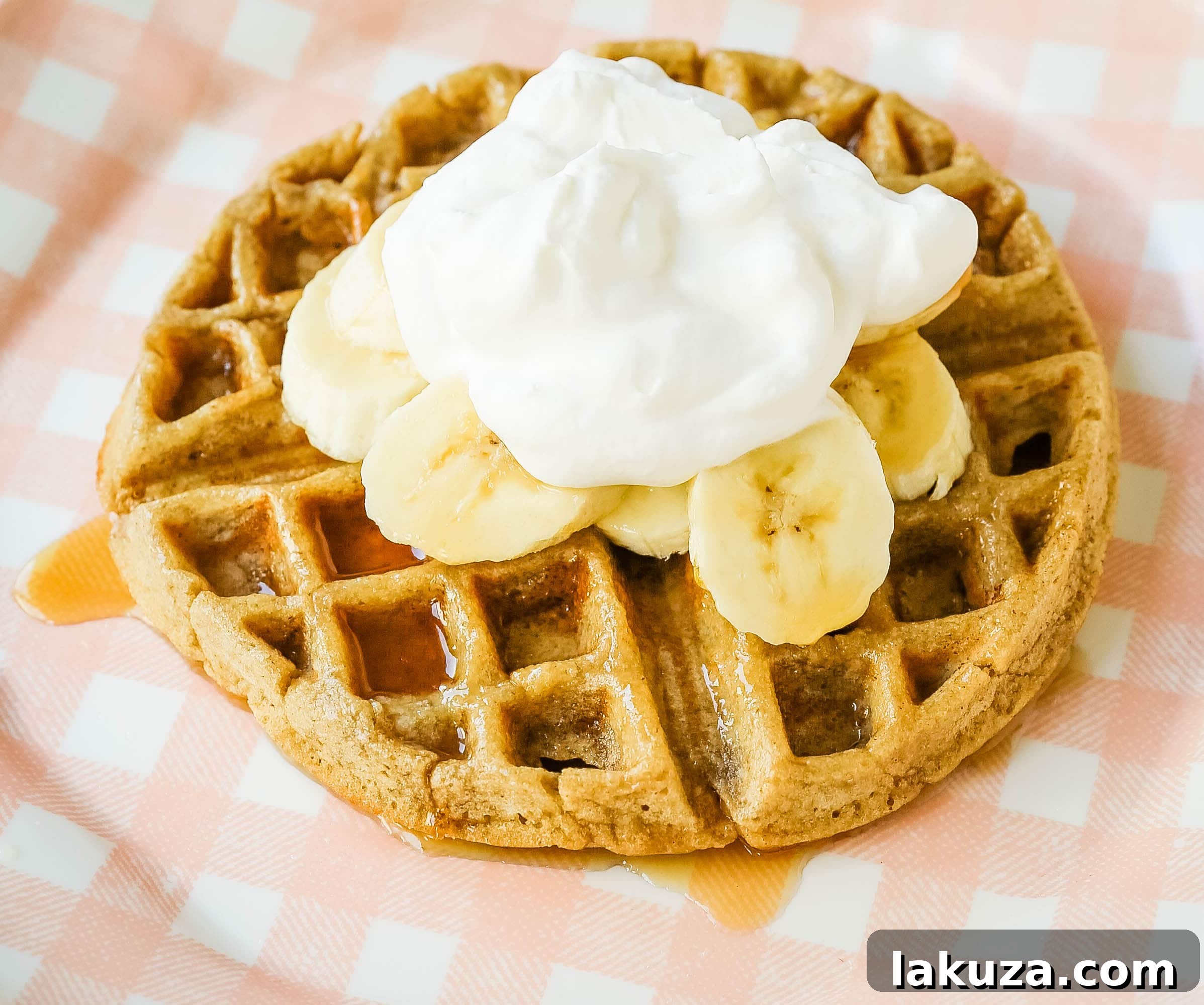 Ingredients for healthy banana oat waffles laid out on a kitchen counter, featuring oats, bananas, and milk